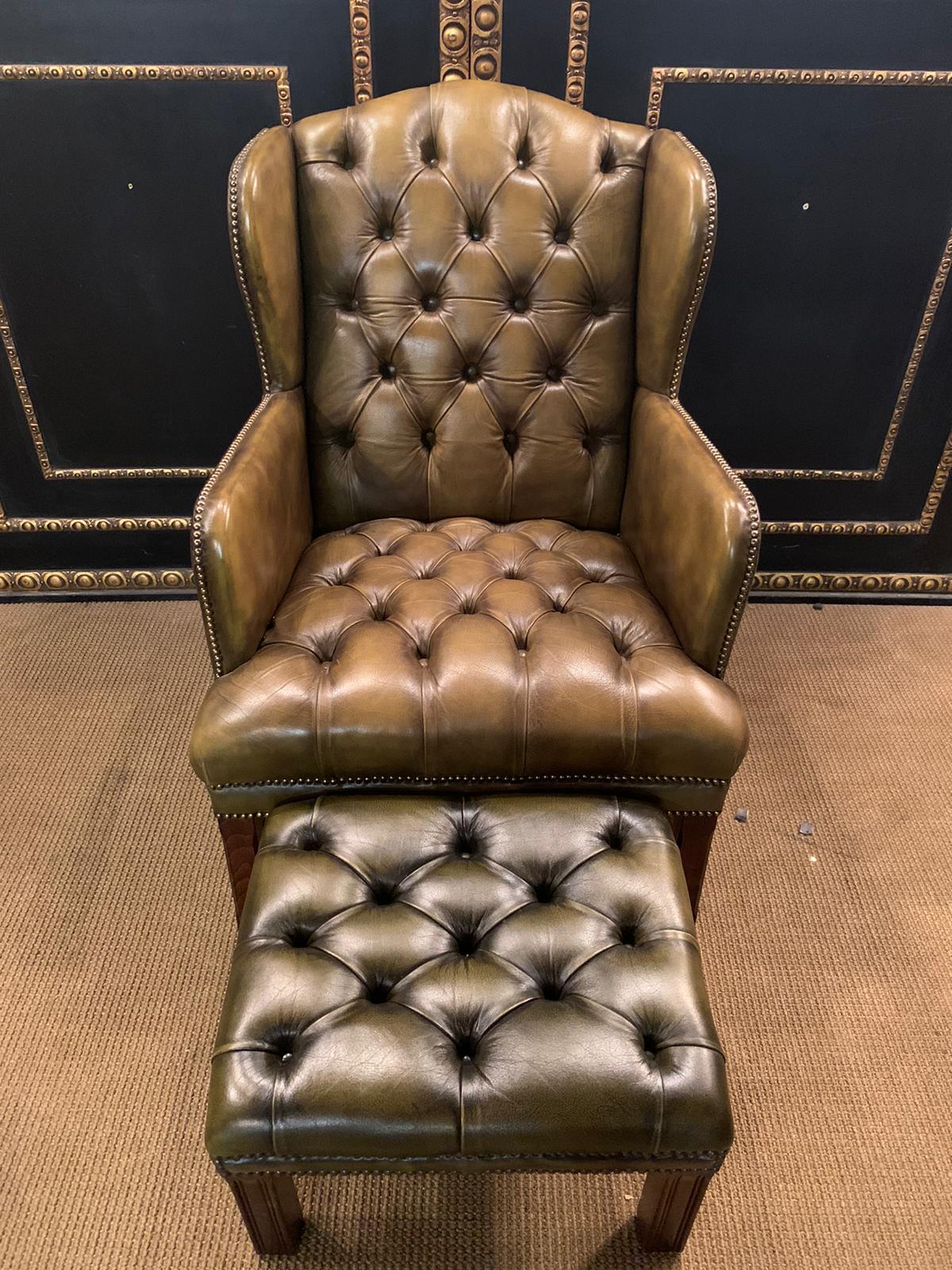 We are delighted to offer for sale this lovely vintage Georgian H-framed Chesterfield wingback armchair and footstool in green leather A lovely pair, full of vintage charm and character, we have lightly restored them to include a deep cleaned hand