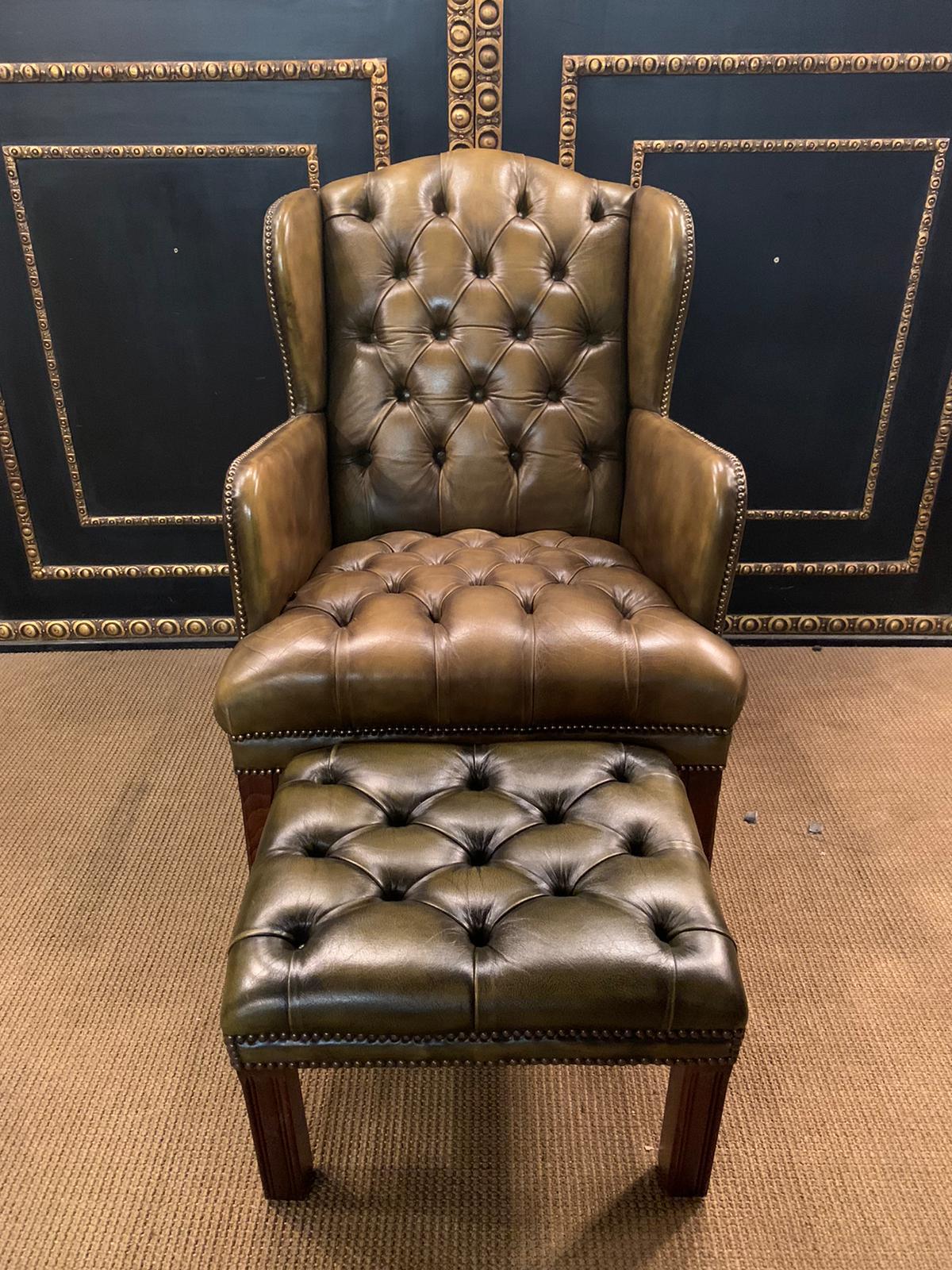 green armchair and footstool