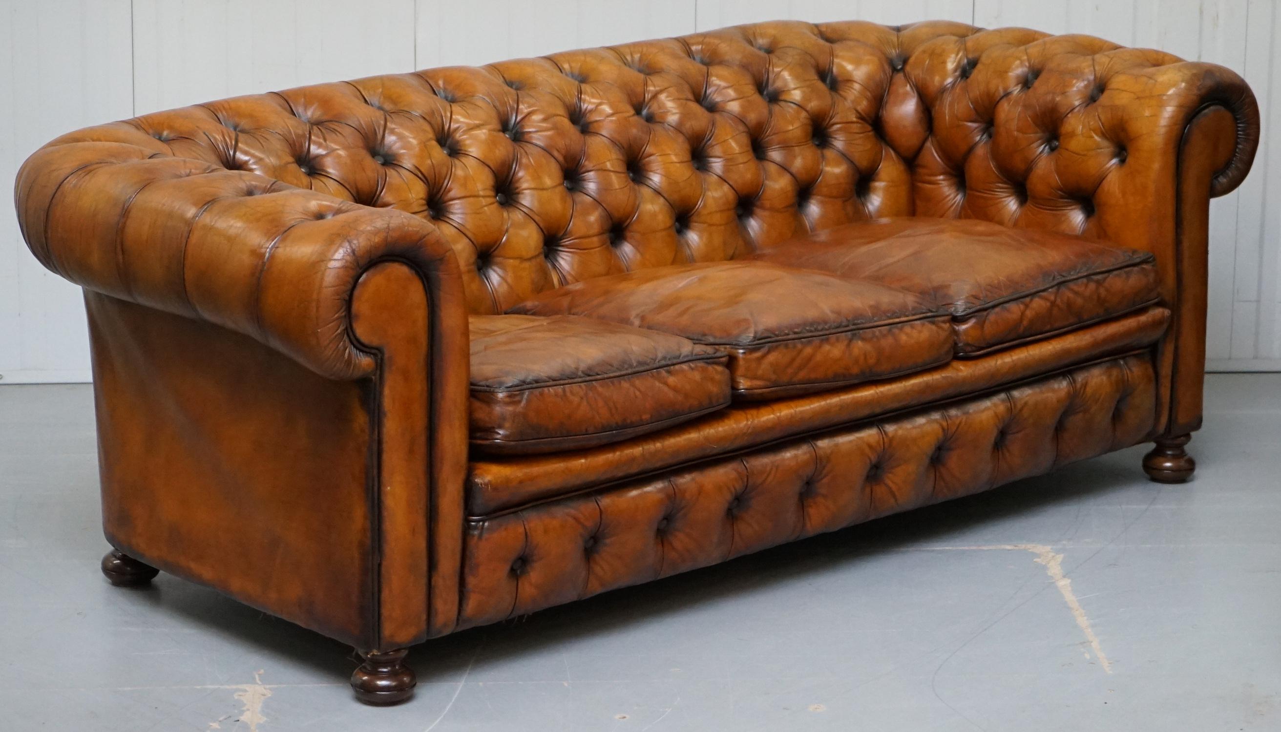 We are delighted to offer for sale this very rare fully restored Vintage hand dyed Whiskey brown leather Chesterfield sofa with original padding, coil sprung all-over and feather filled cushions 

This sofa is a very rare model, its fully sprung