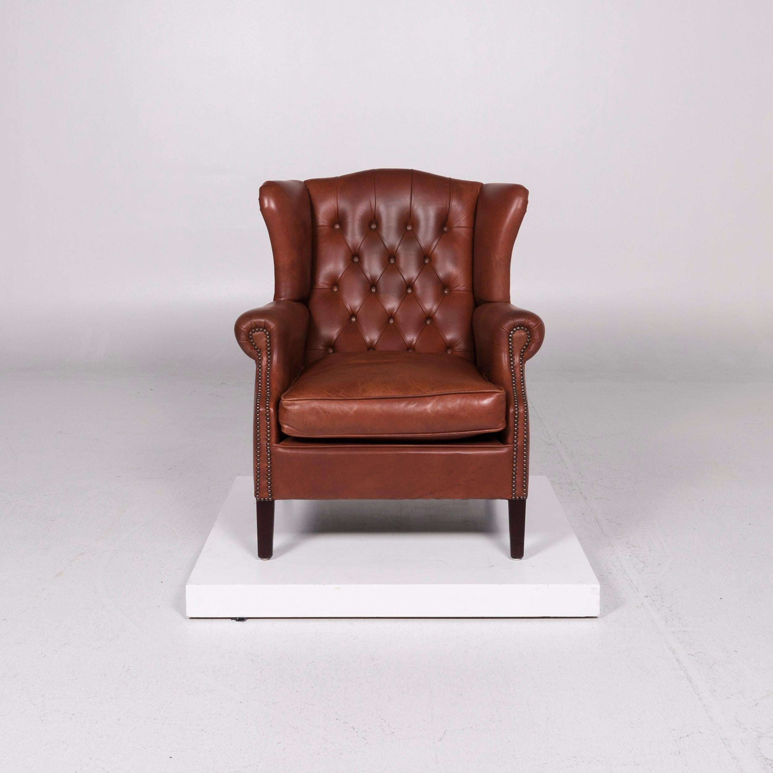 We bring to you a Chesterfield leather armchair red brown retro.

 Product measurements in centimeters:
 
Depth 94
Width 82
Height 99
Seat-height 49
Rest-height 60
Seat-depth 59
Seat-width 52
Back-height 50.
  
