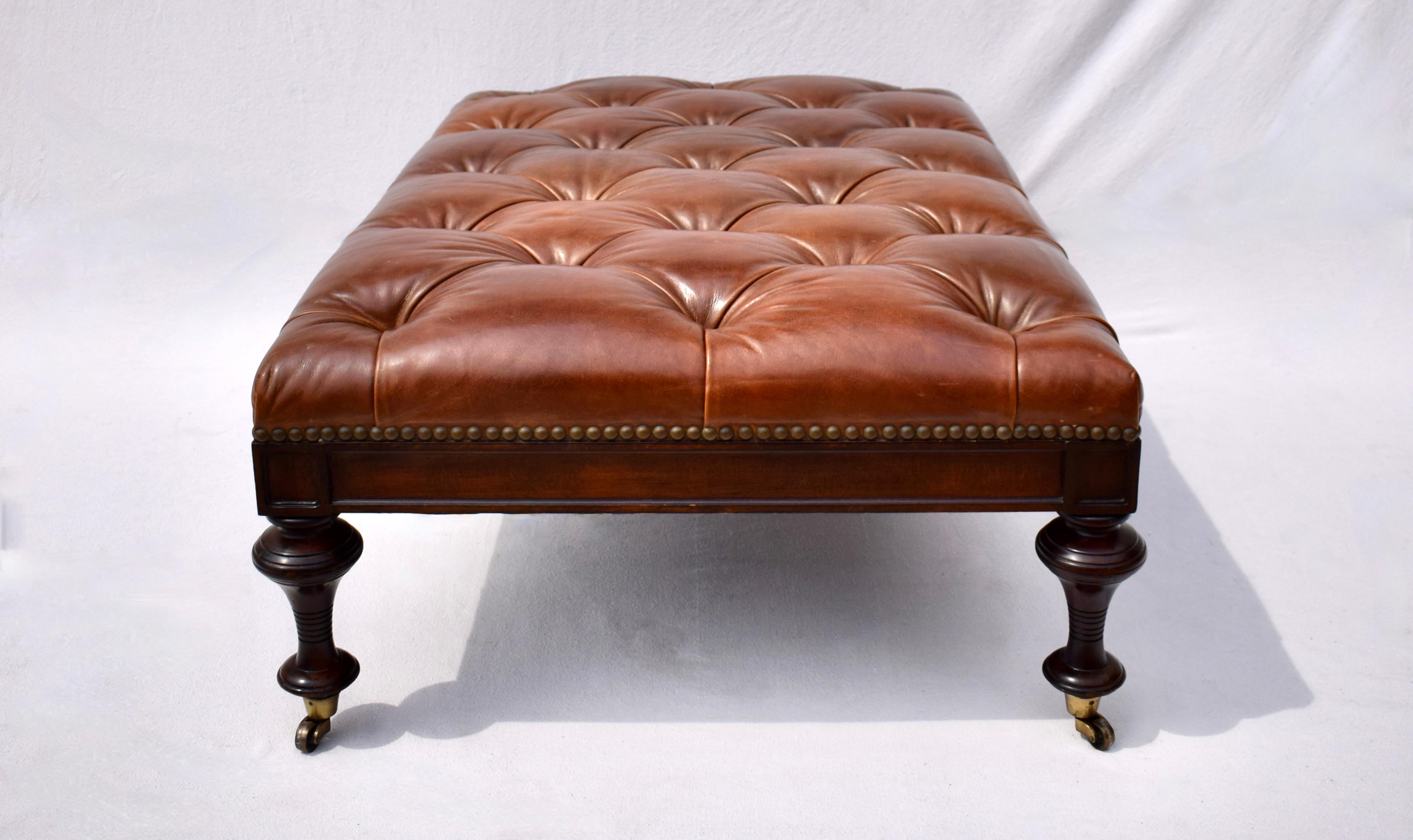 American Chesterfield Leather Ottoman on Brass Casters by Drexel  For Sale