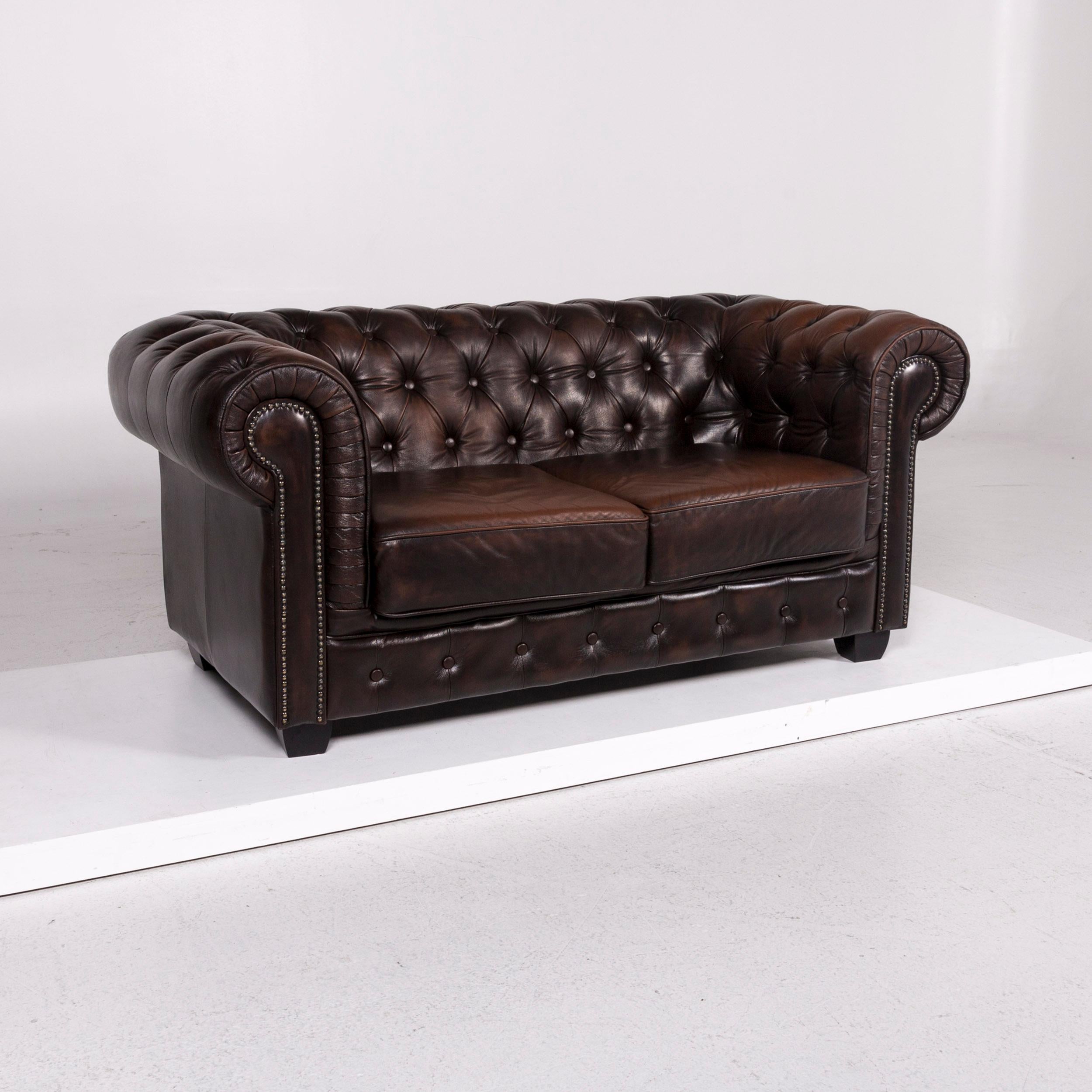 We bring to you a Chesterfield leather sofa brown dark brown two-seat retro couch.

 

 Product measurements in centimeters:
 

Depth 97
Width 172
Height 76
Seat-height 44
Rest-height 76
Seat-depth 57
Seat-width 108
Back-height 30.