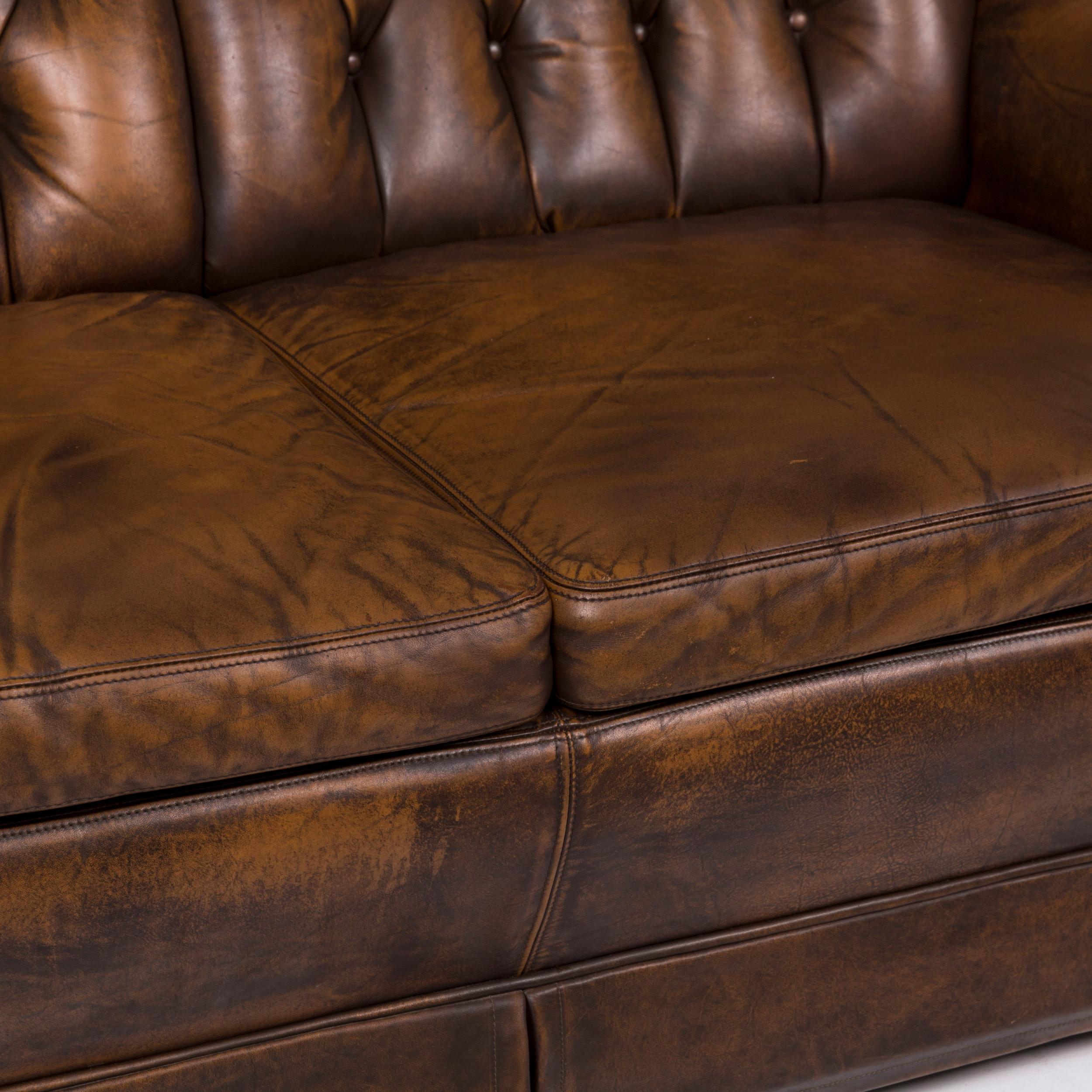 We bring to you a Chesterfield leather sofa brown two-seat.


 Product measurements in centimeters:
 

Depth 92
Width 138
Height 98
Seat-height 43
Rest-height 52
Seat-depth 56
Seat-width 107
Back-height 50.
 