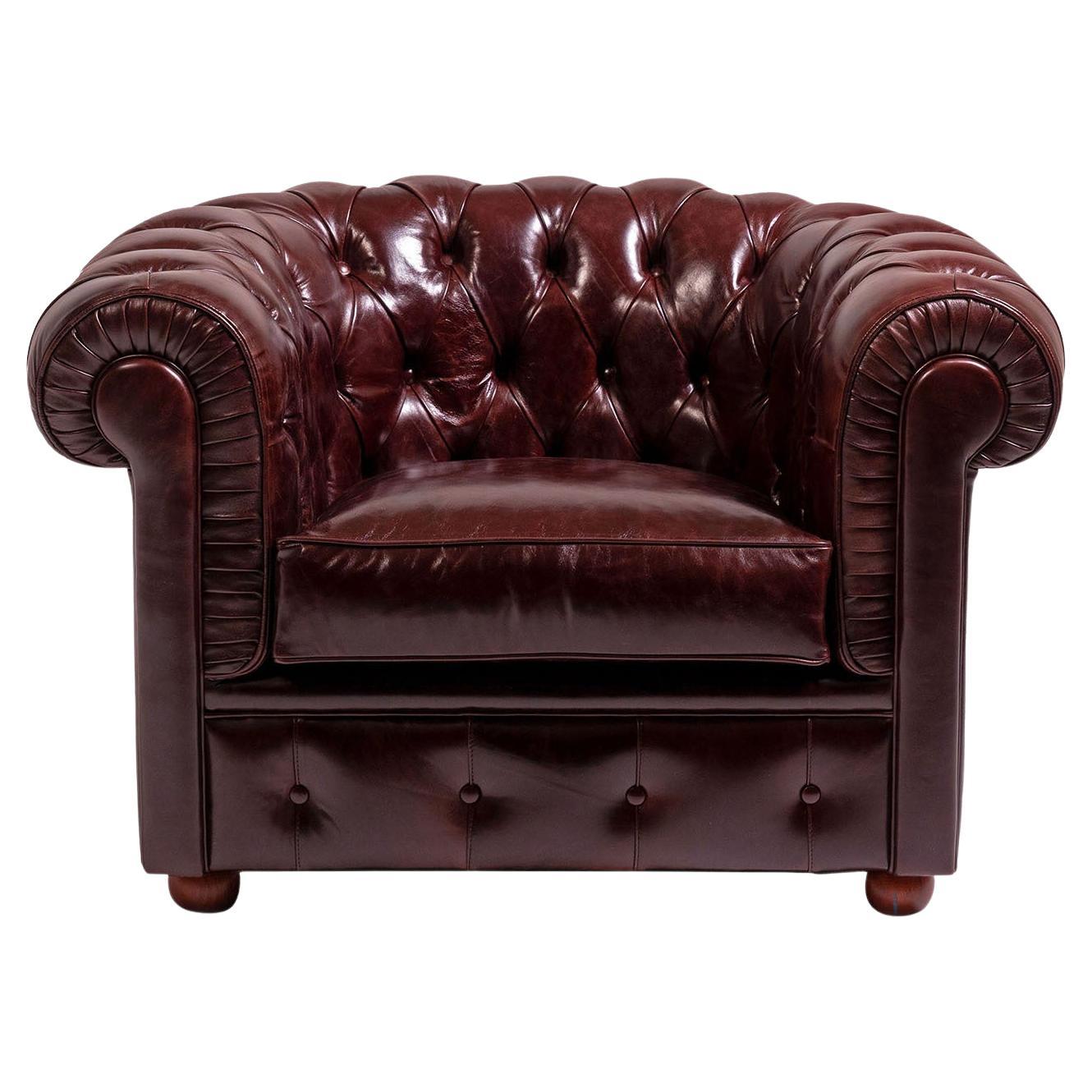 Chesterfield ruby red leather armchair by Mantellassi 1926
