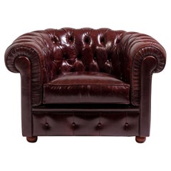 Chesterfield ruby red leather armchair by Mantellassi 1926