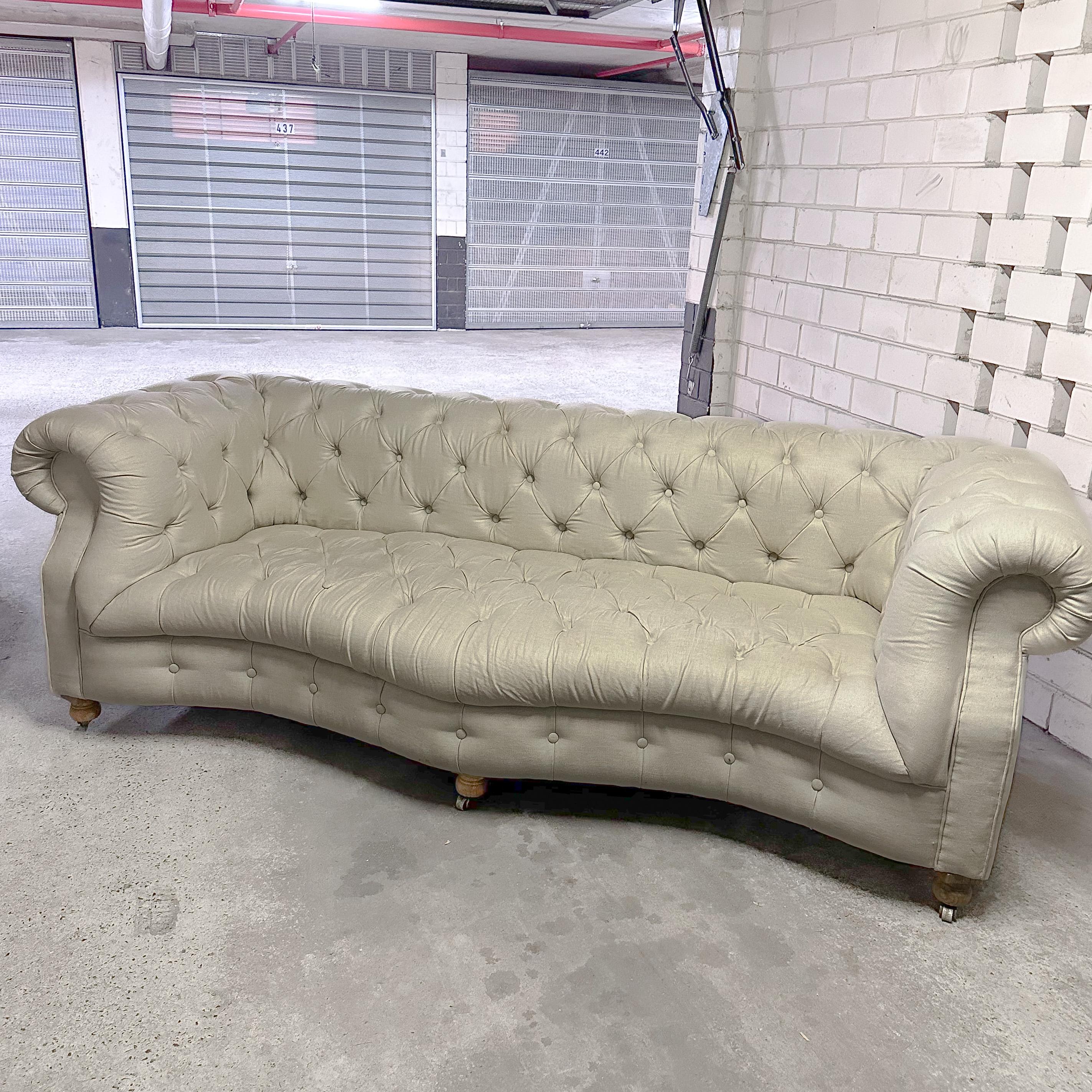 Timothy Oulton Serpentine sofa. Fully buttoned-up Chesterfield style with elegant contours and classic hand-tufting.

Named after the Serpentine river in England, due to its languid curve of the front seat which lends a softer, more feminine