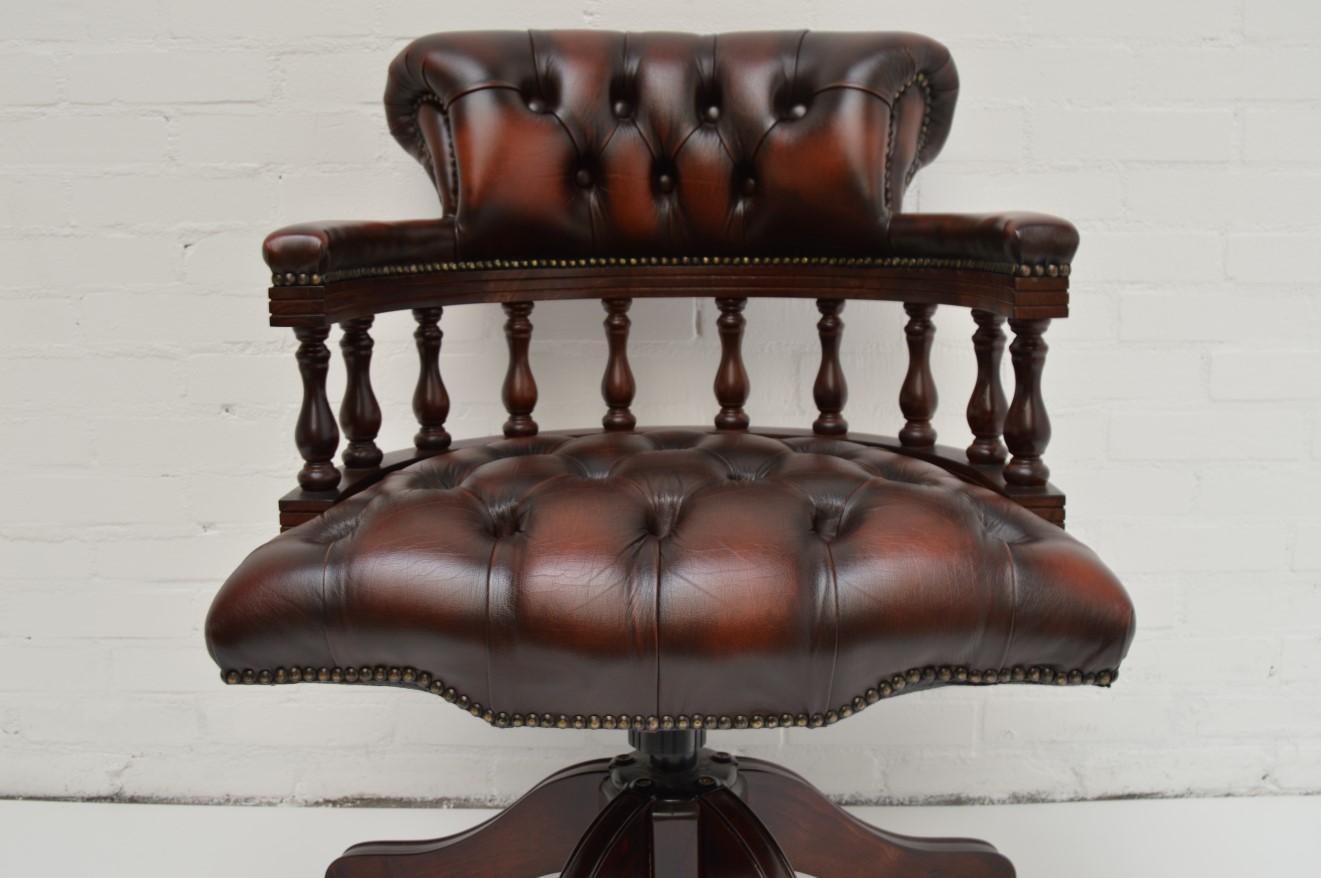This Chesterfield captain's swivel chair is perfect as an office chair to fit behind a nice desk. Elegant, not to big and stylish with the wood and leather combination.

Customized with buttoned back and buttoned seat. Leather gained character in
