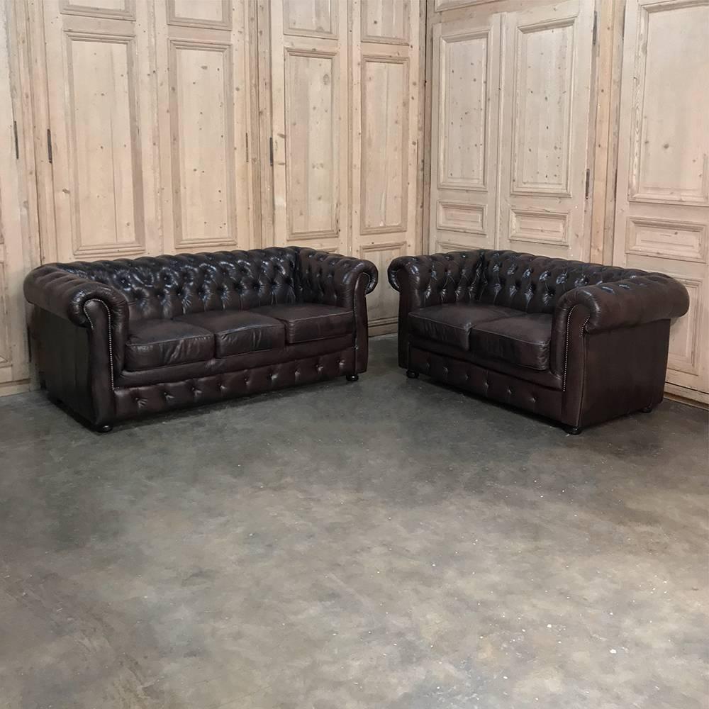 Chesterfield leather sofa features classic tufted seatback with wraparound, overstuffed comfort! Brown colored leather sofa in an elegant vintage style, designed for pure comfort,
 
circa mid-1900s
Measures 30 H x 74 W x 32 D.