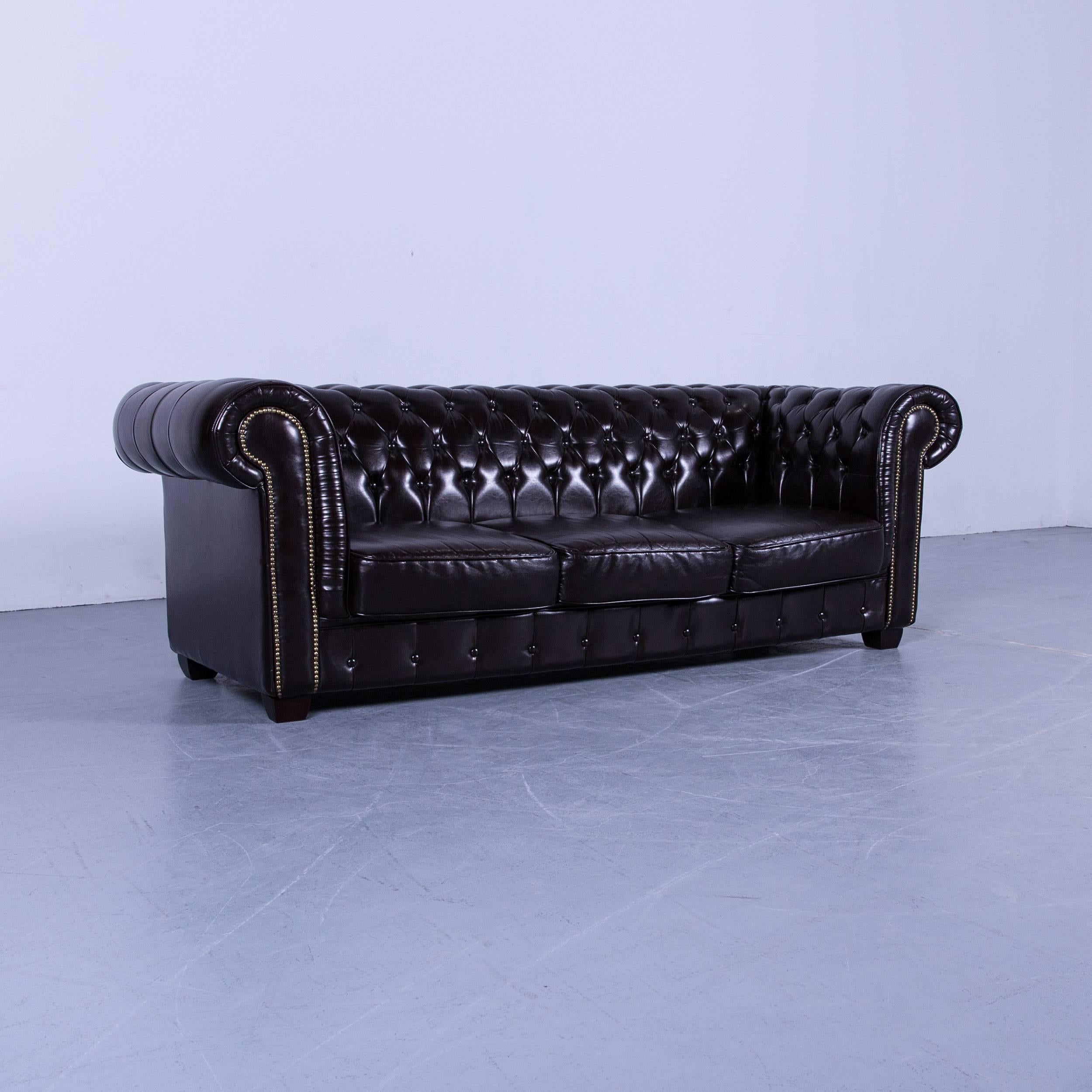 Chesterfield three-seat sofa in brown color leather couch vintage retro rivets, made for pure comfort and elegance.