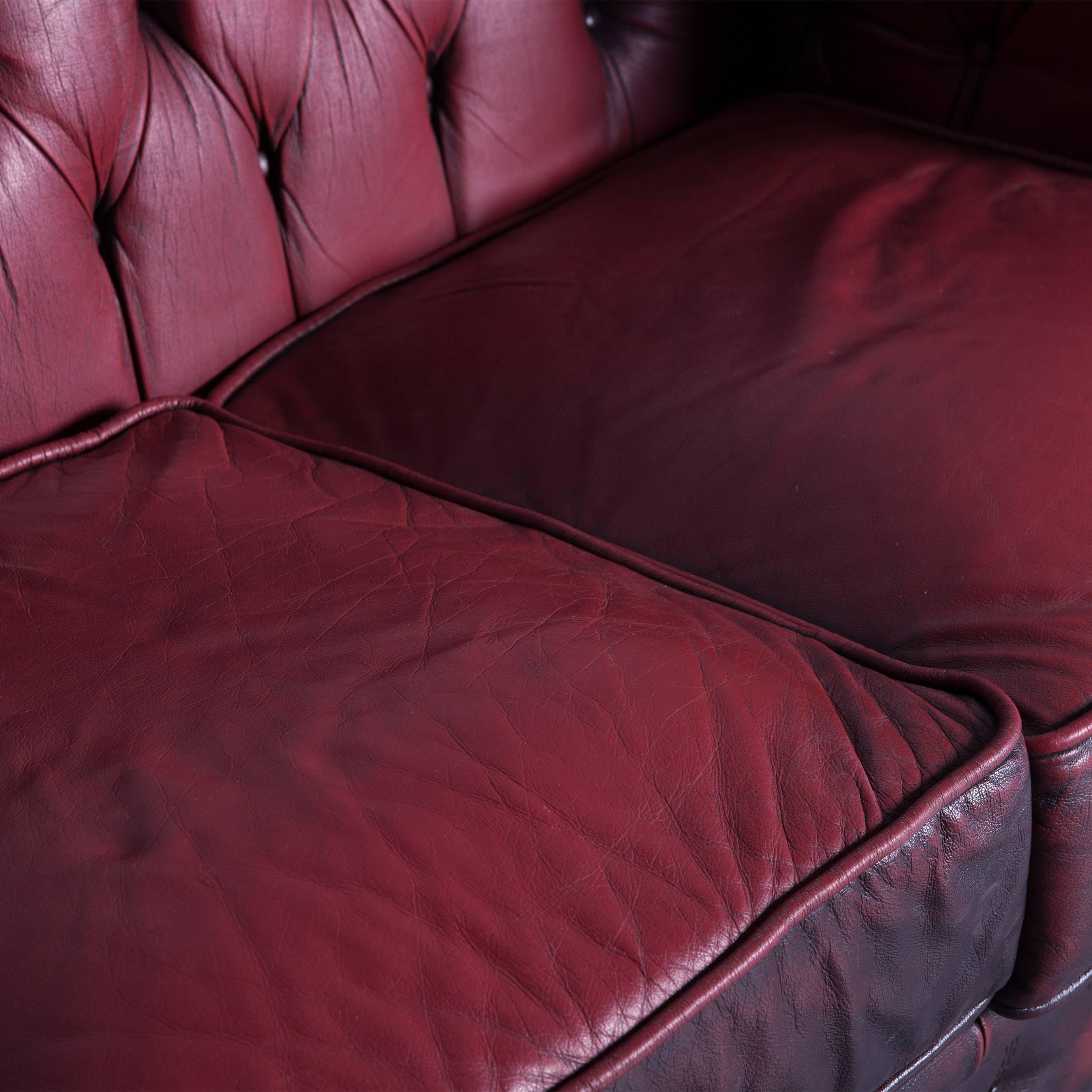Chesterfield three-seat sofa red leather couch vintage retro rivets, made for pure comfort and elegance.