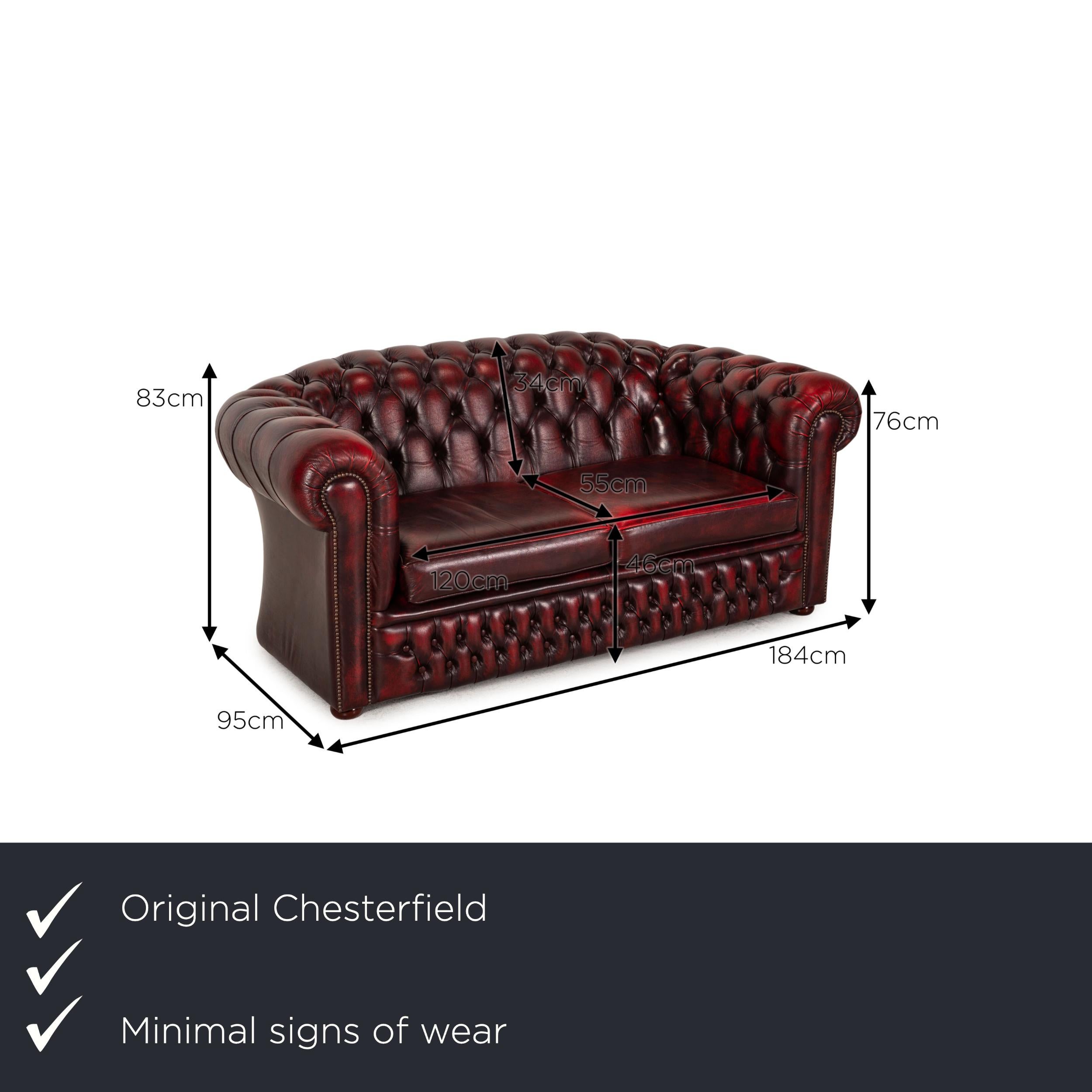 We present to you a Chesterfield Tudor leather sofa dark red two seater couch.

Product measurements in centimeters:

depth: 95
width: 184
height: 83
seat height: 46
rest height: 76
seat depth: 55
seat width: 120
back height: 34.
 
 
