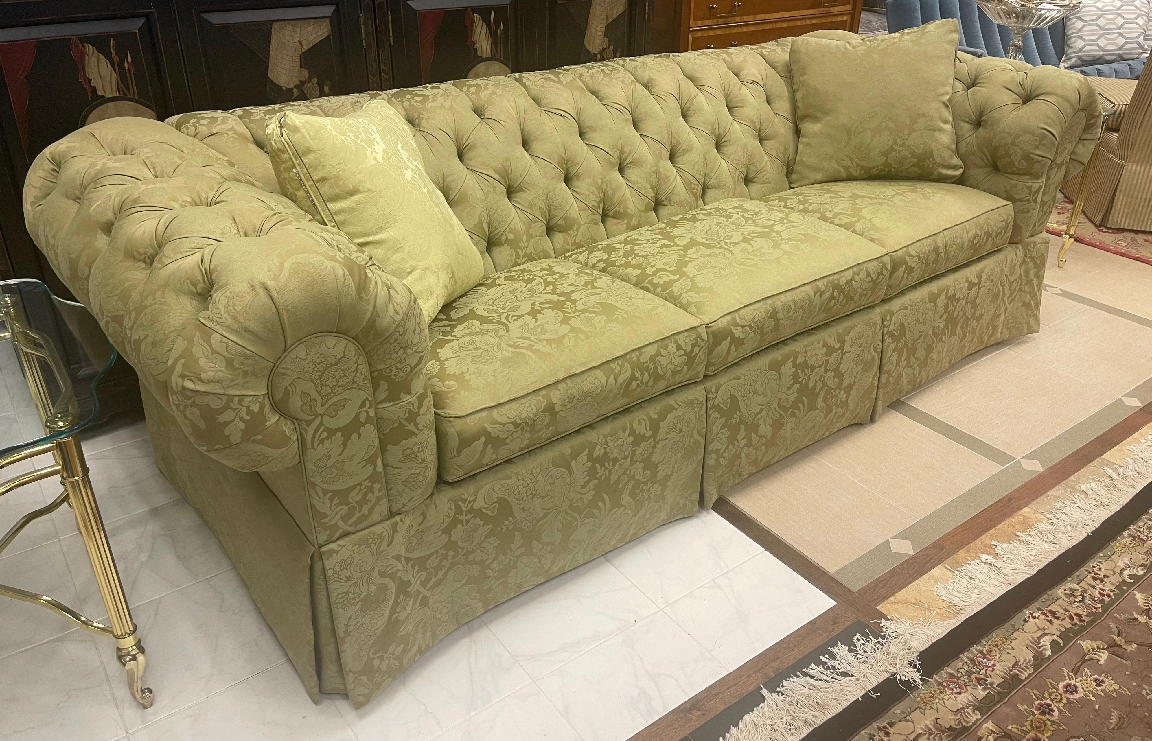 Elegant and presidential Ethan Allen late 20th Century chesterfield sofa.
The fabric here, in this case and olive cotton and silk blend with subtle paisley design, steals the show.  A big sofa that will sit more than the three cushion allow.