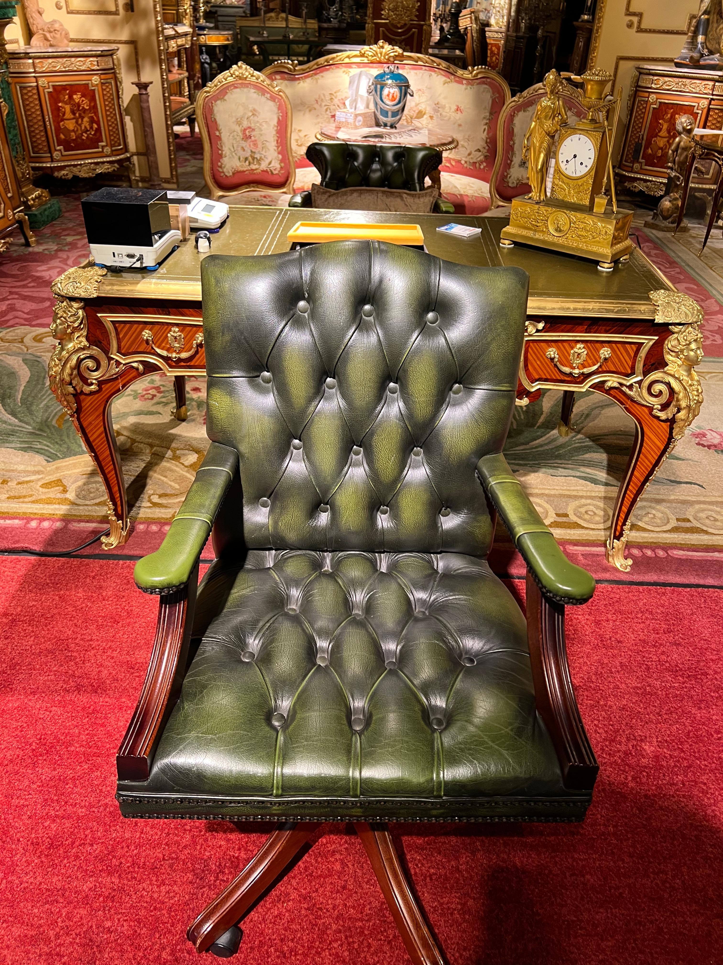 Stunning original handmade in England hand dyed deep green leather captain's chair, a stunning piece, the frame is solid and beautifully finished mahogany, the leather is English cowhide and nice and thick, every button has been hand finished. The