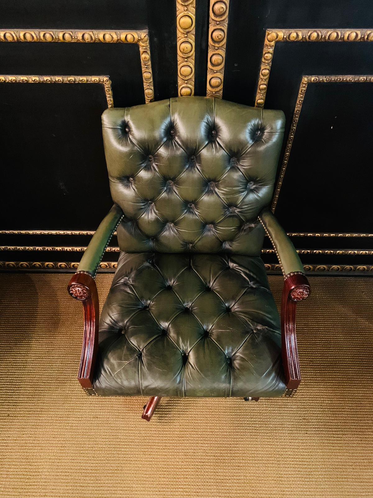Stunning original handmade in England hand dyed deep Green leather captains armchair a stunning piece, the frame is solid and beautifully crafted mahogany with a beautiful carving on the head, the leather is English cattle hide and nice and thick,