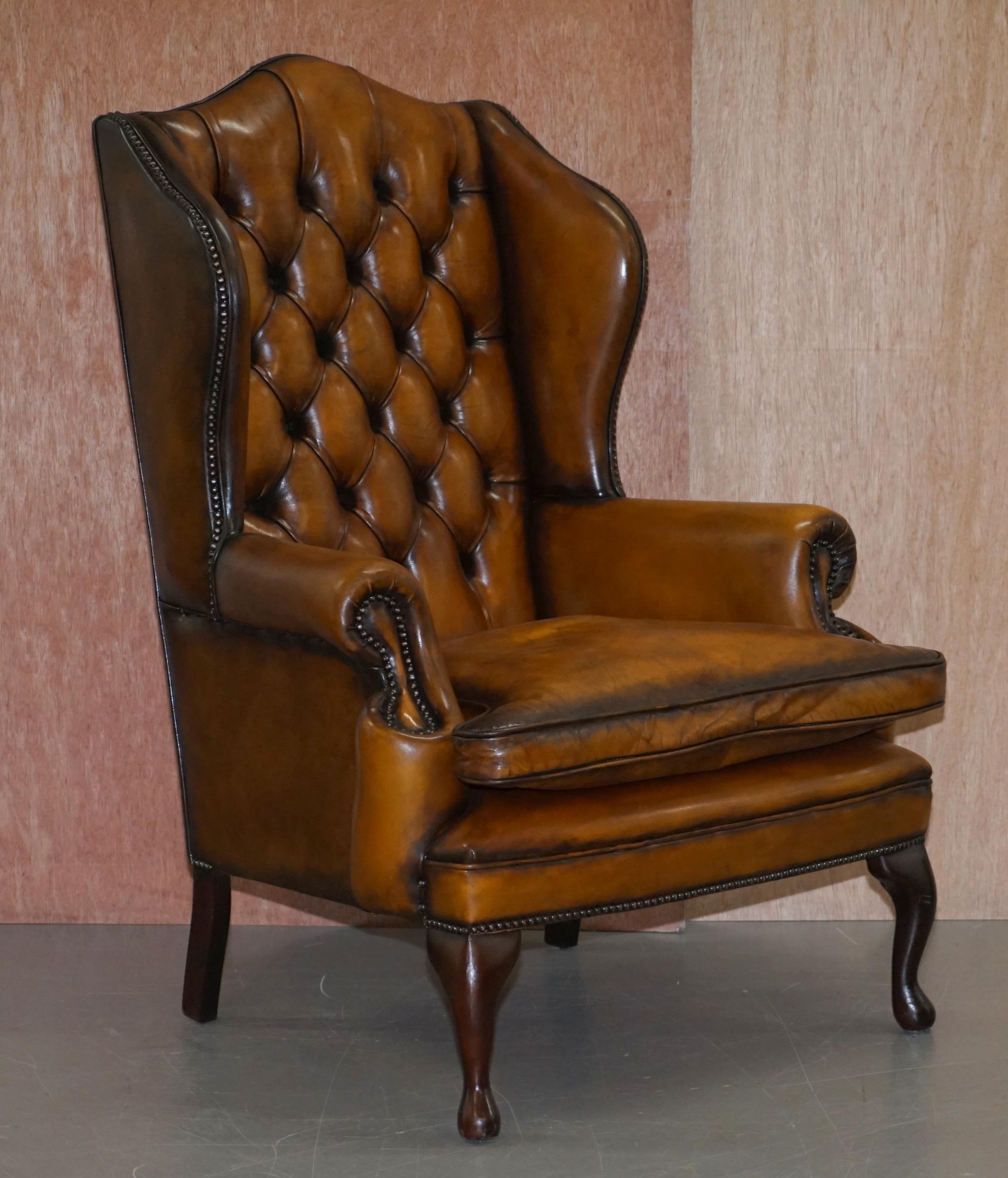 We are delighted to offer for sale this stunning William Morris style Chesterfield fully restored vintage wingback armchair and footstool in Whisky brown leather with thick heavy feather filled cushion and coil sprung base 

A good looking and