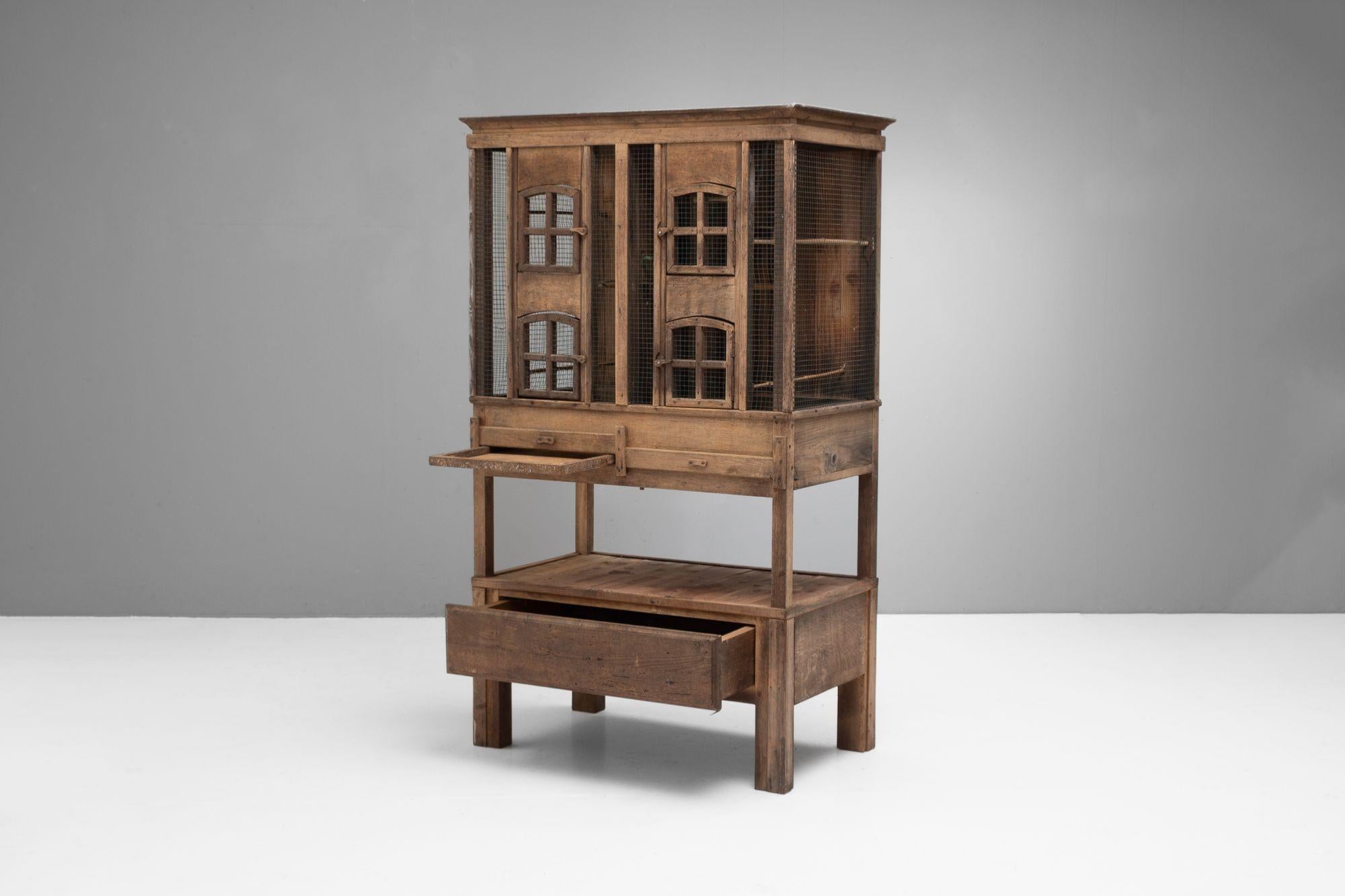 Rustic aviary in chestnut. France circa 1950.

H 172cm x W 101cm x D 61cm

Please be in touch for an accurate shipping quote.