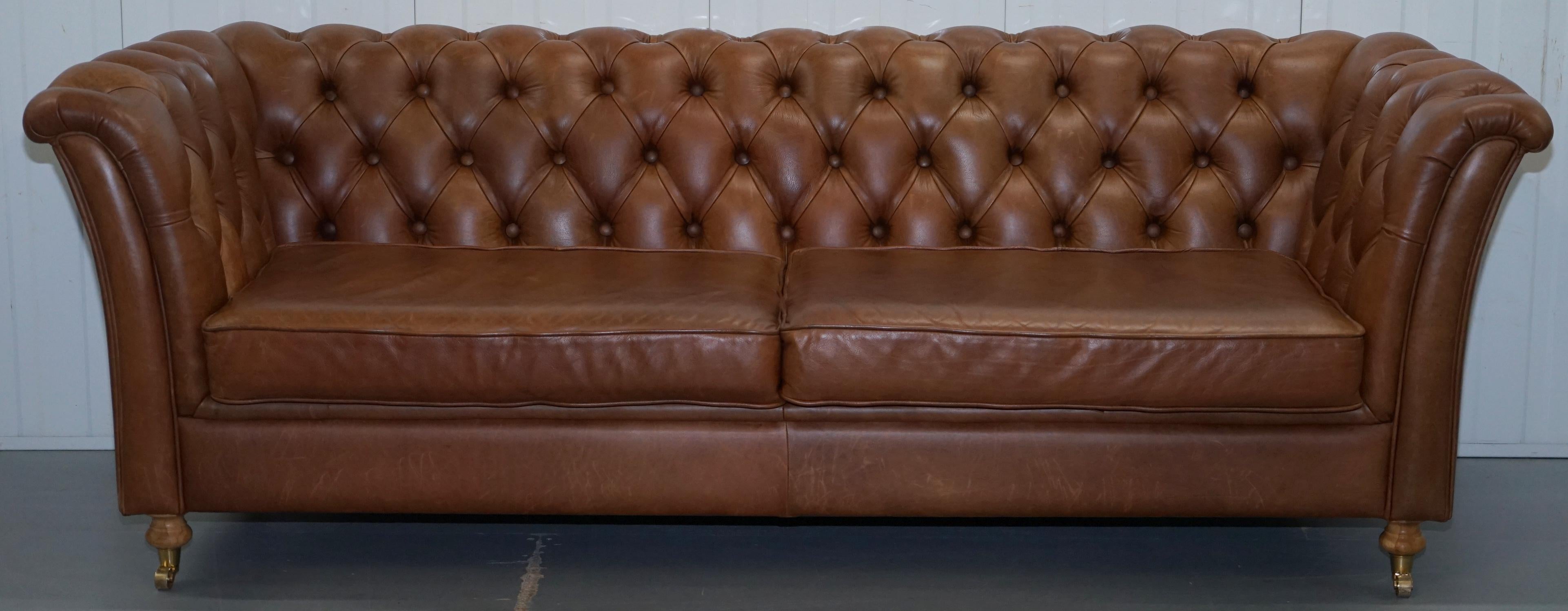 We are delighted to offer for sale this very nice sculptural Chesterfield Chestnut brown leather sofa with oversized buttons

A good looking and well-made piece, it's very very heavy compared to other contemporary Chesterfield sofas, the frame is