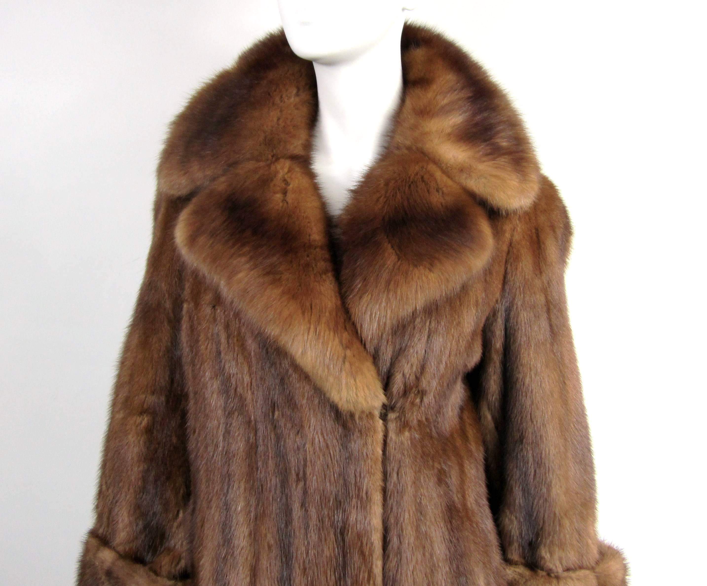 Vintage Chestnut Brown Mink Coat with a stunning wide collar. Brown lining with velvet accents on the side, no monogram. Coat has 2 hook and eye closures, which can be moved to adjust the sizing, easy fix at your tailor. Soft and Supple fur.