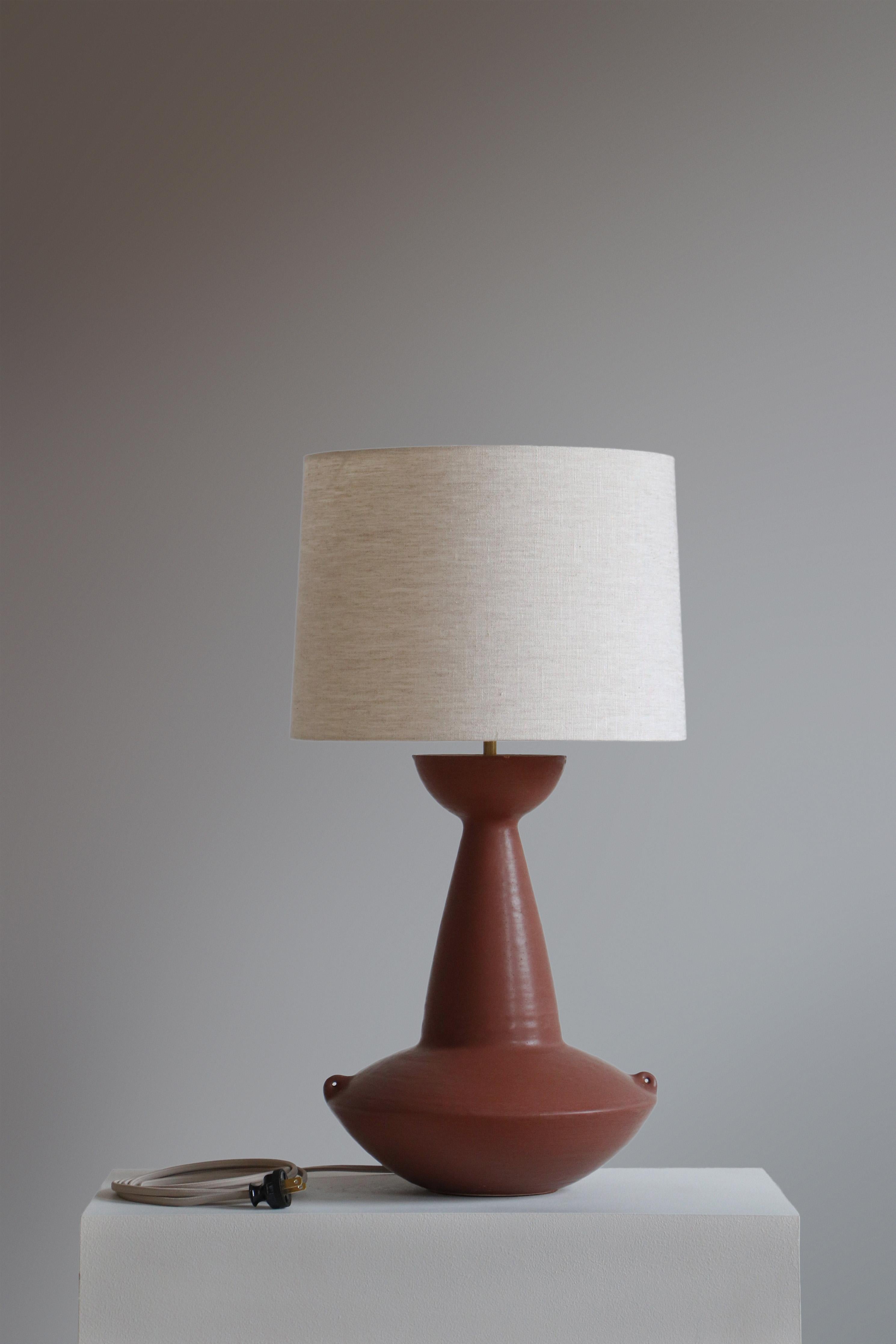Chestnut Claudius Table Lamp by Danny Kaplan Studio
Dimensions: ⌀ 36 x H 69 cm
Materials: Glazed Ceramic, Unfinished Brass, Linen

This item is handmade, and may exhibit variability within the same piece. We do our best to maintain a consistent