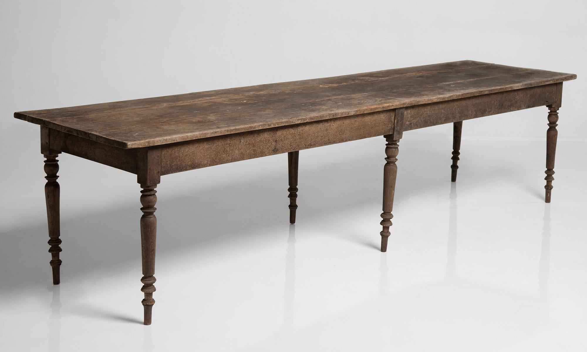 Chestnut dining table, England, circa 1840.

Single drawer table with a 3 plank top and turned legs. Amazing patina. Originally used at Notre-Dame de Langonnet Abbey.