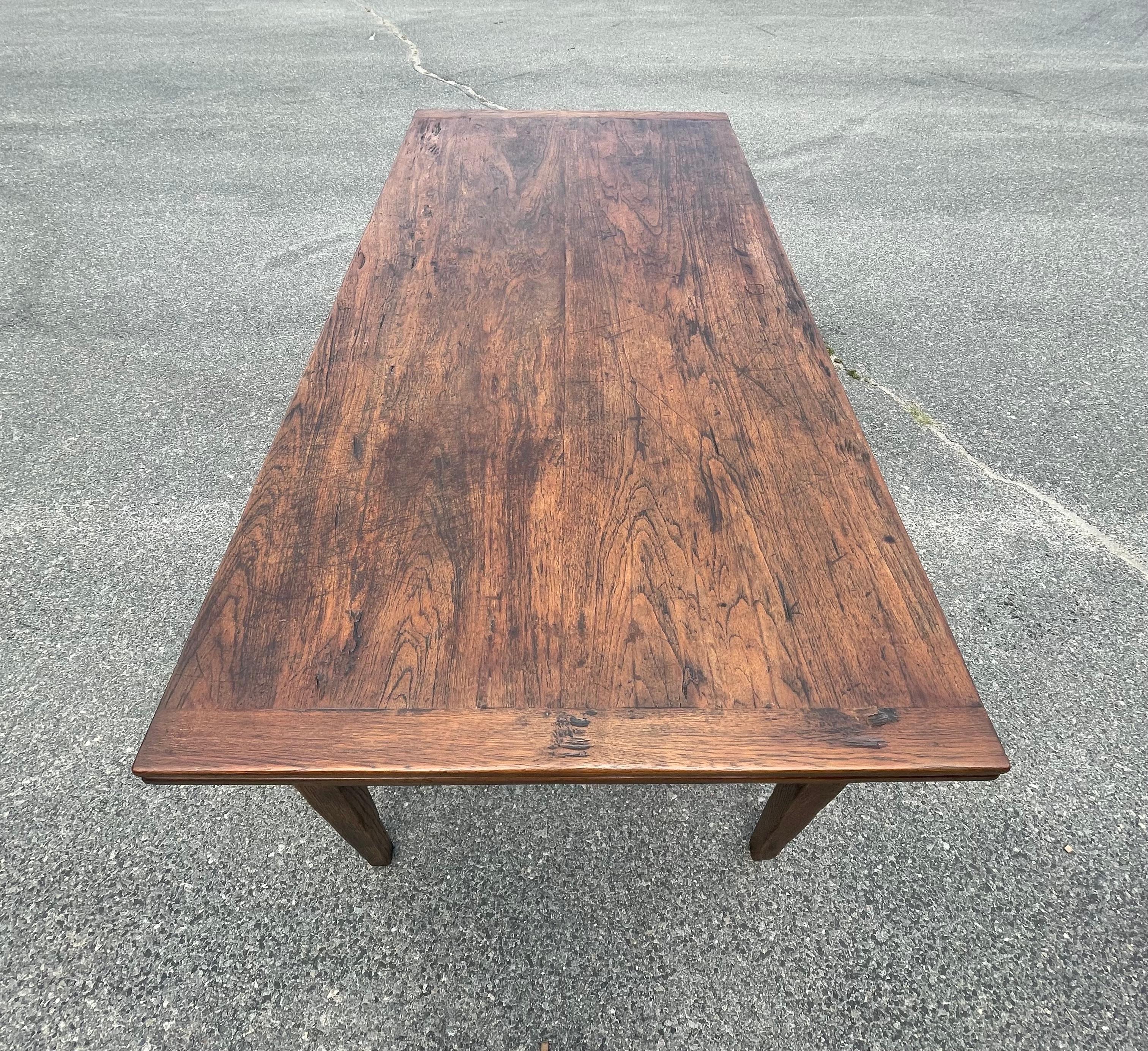 Chestnut dining table with draw leaf extensions on either side.  Top with nutty brown finish and rich aged look.  On taper legs.
Extends to 116 inches