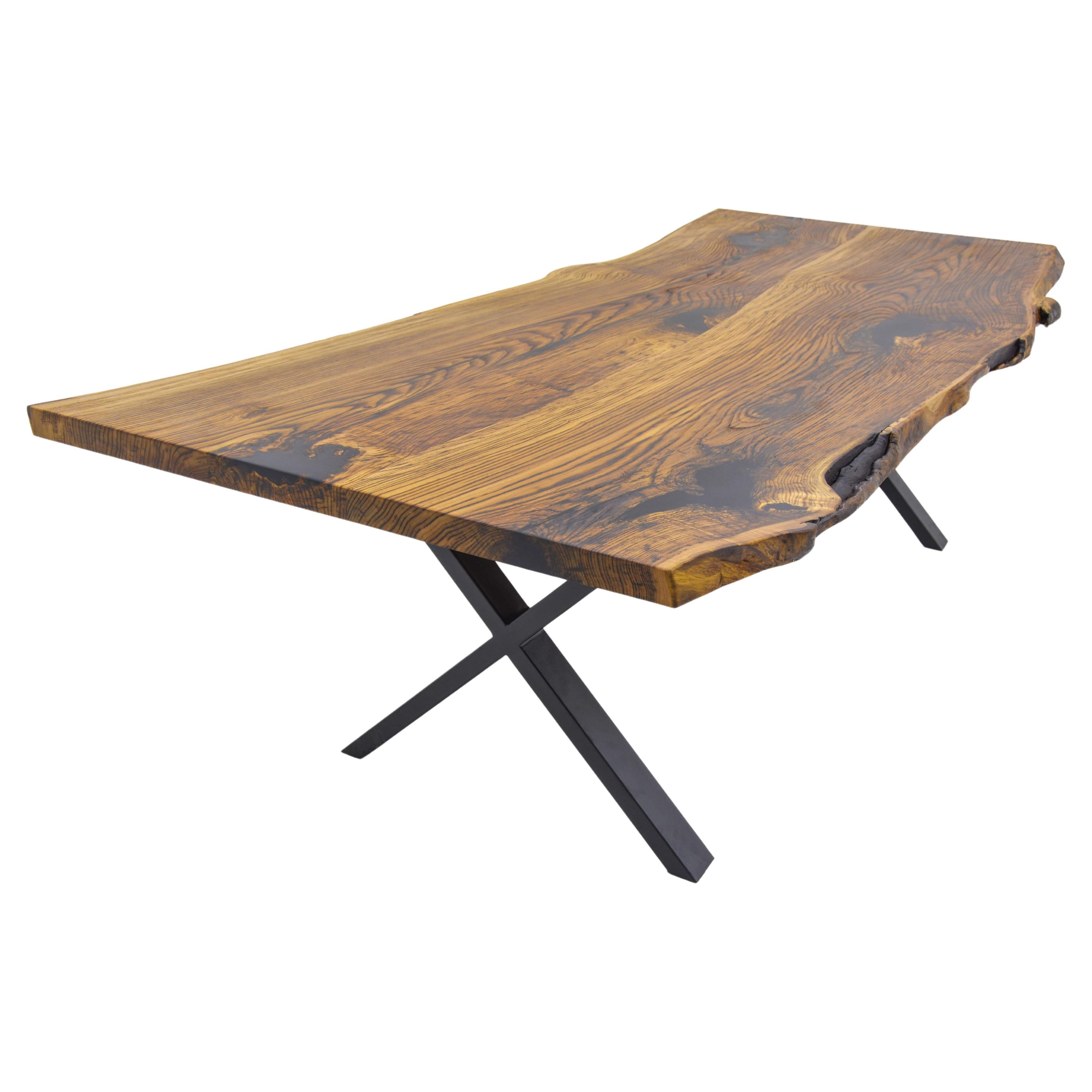 Custom Chestnut Live Edge Kitchen Table 

This table is made of Chestnut Wood. The grains and texture of the wood describe what a natural chestnut woods looks like.
It can be used as a dining table or as a conference table. Suitable for indoor
