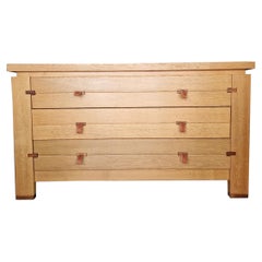 Chests of drawers in oak and leather handles by Maison Regain