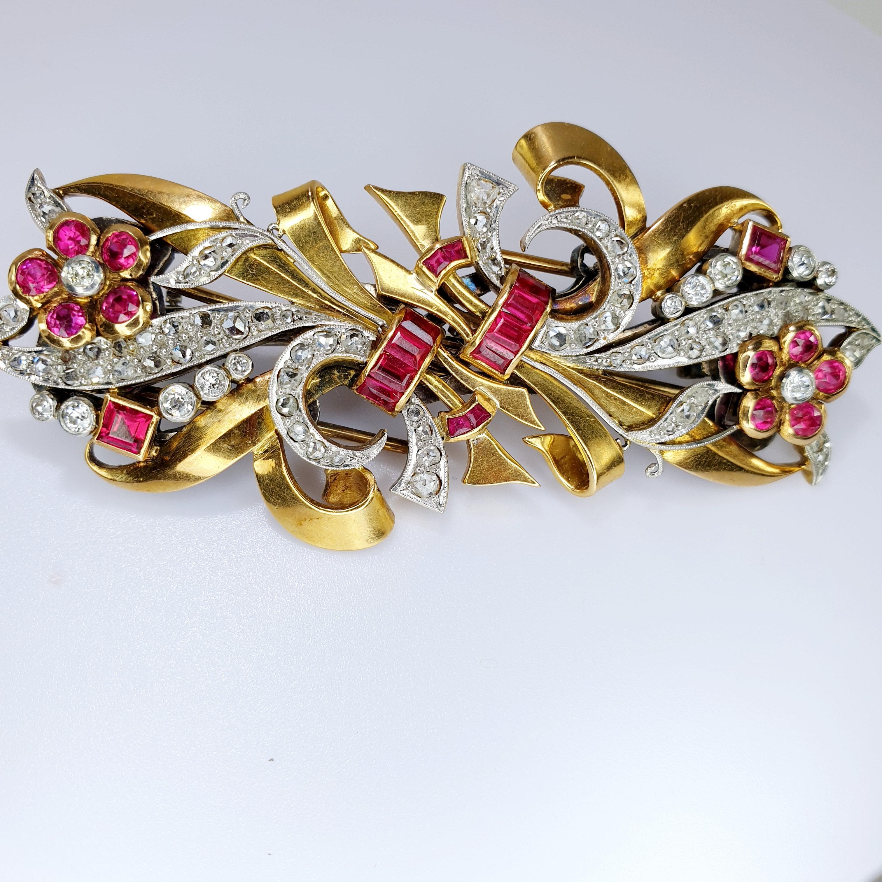 This beautiful Chevalier epoque  1940's clips can be worn separately or together by its custom fitting. 
The diamond and gold ribbon swirl iand nests ruby colored gems. The brooch is 18k rose gold  and fitting is 18k white gold. 
Can be used in