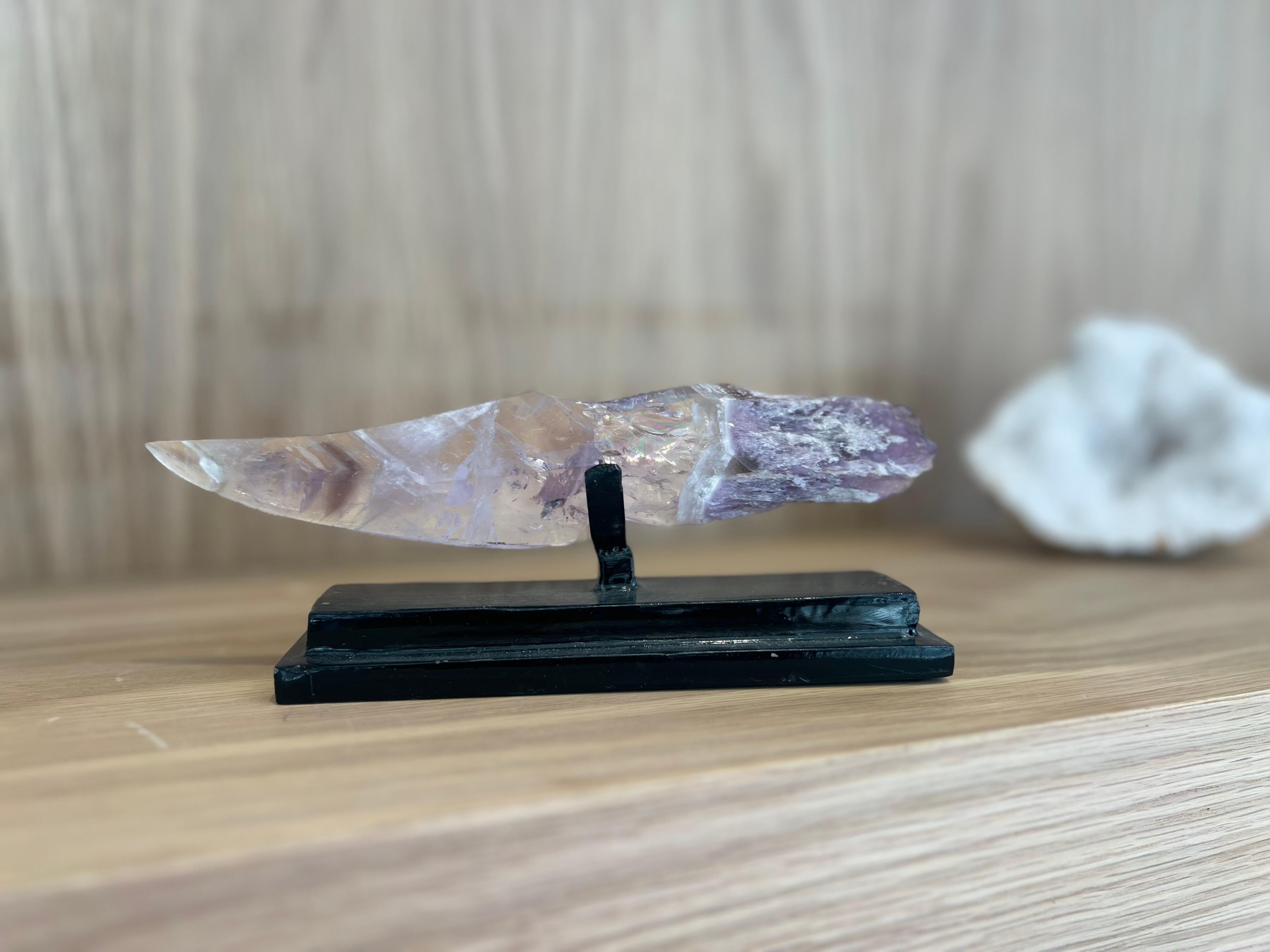 This one of a kind hand-carved beauty is a Chevron Amethyst. Chevron is denoted by the v shaped stripes throughout the quartz. 
The handle is pure raw amethyst. Crystal daggers symbolize protection of oneself and others. They represent bravery and
