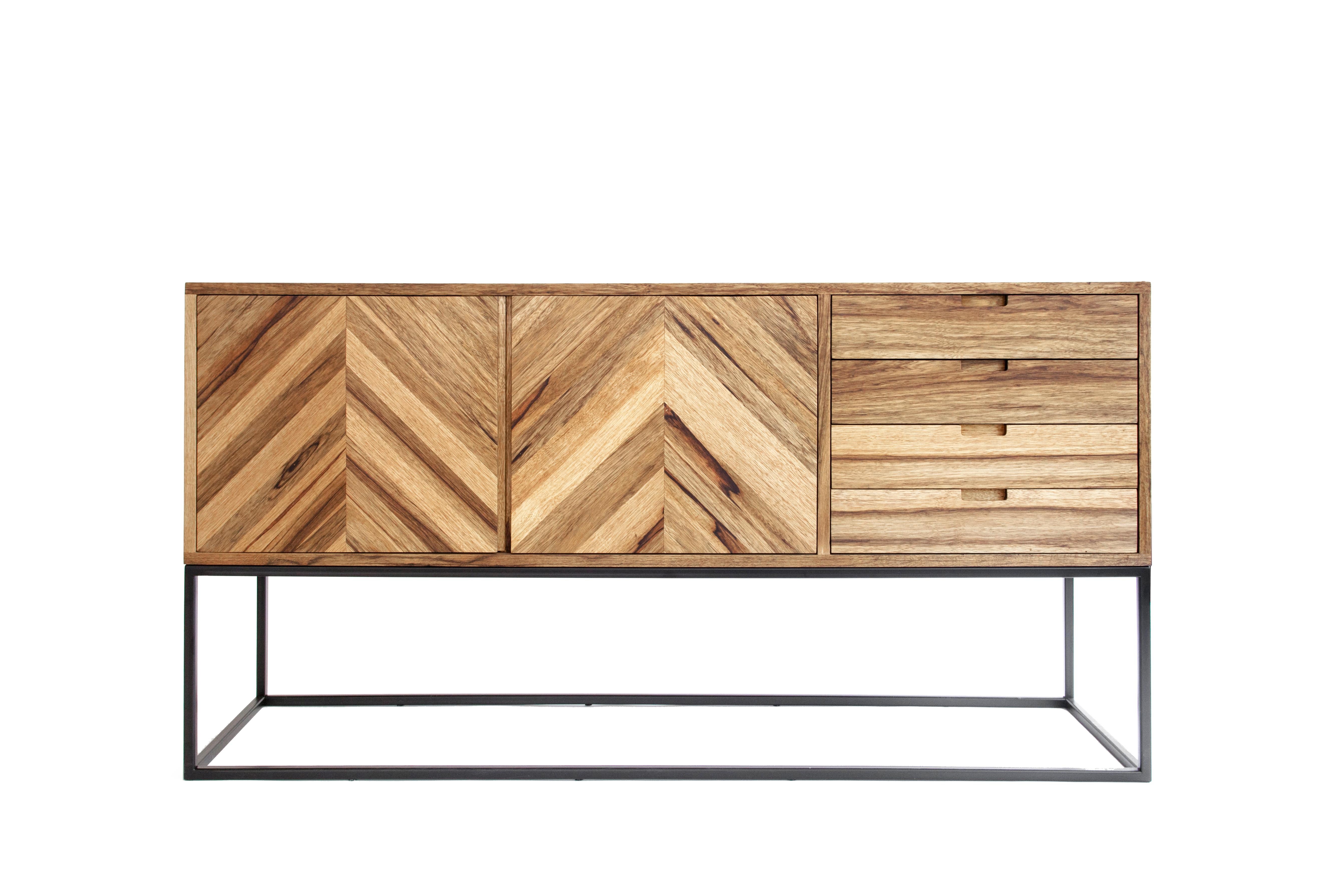 The chevron credenza is a functional handmade a solid wood sideboard.

The minimalistic design is accentuated by the chevron pattern made with solid wood marquetery and unassuming rectangular steel frame evoking functionality, elegance and