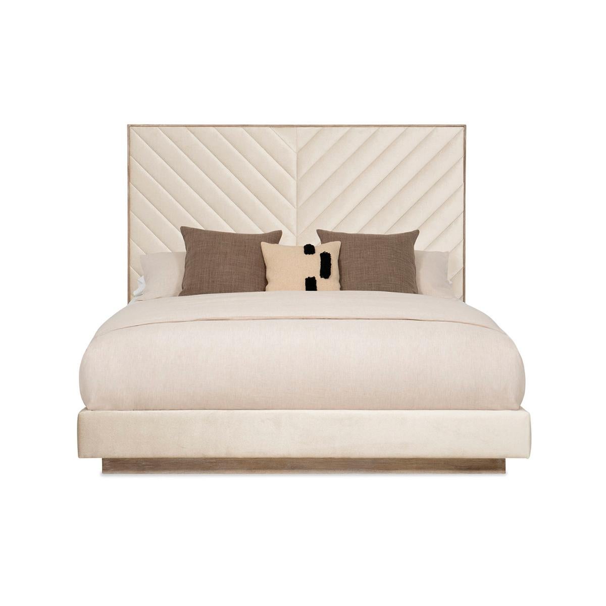 With an Ash Driftwood finish frame. It has a tall upholstered headboard with a modern channel tufting design of converging angles that meet in the center to create a mesmerizing chevron. This bed’s fully finished sides appear to float above the