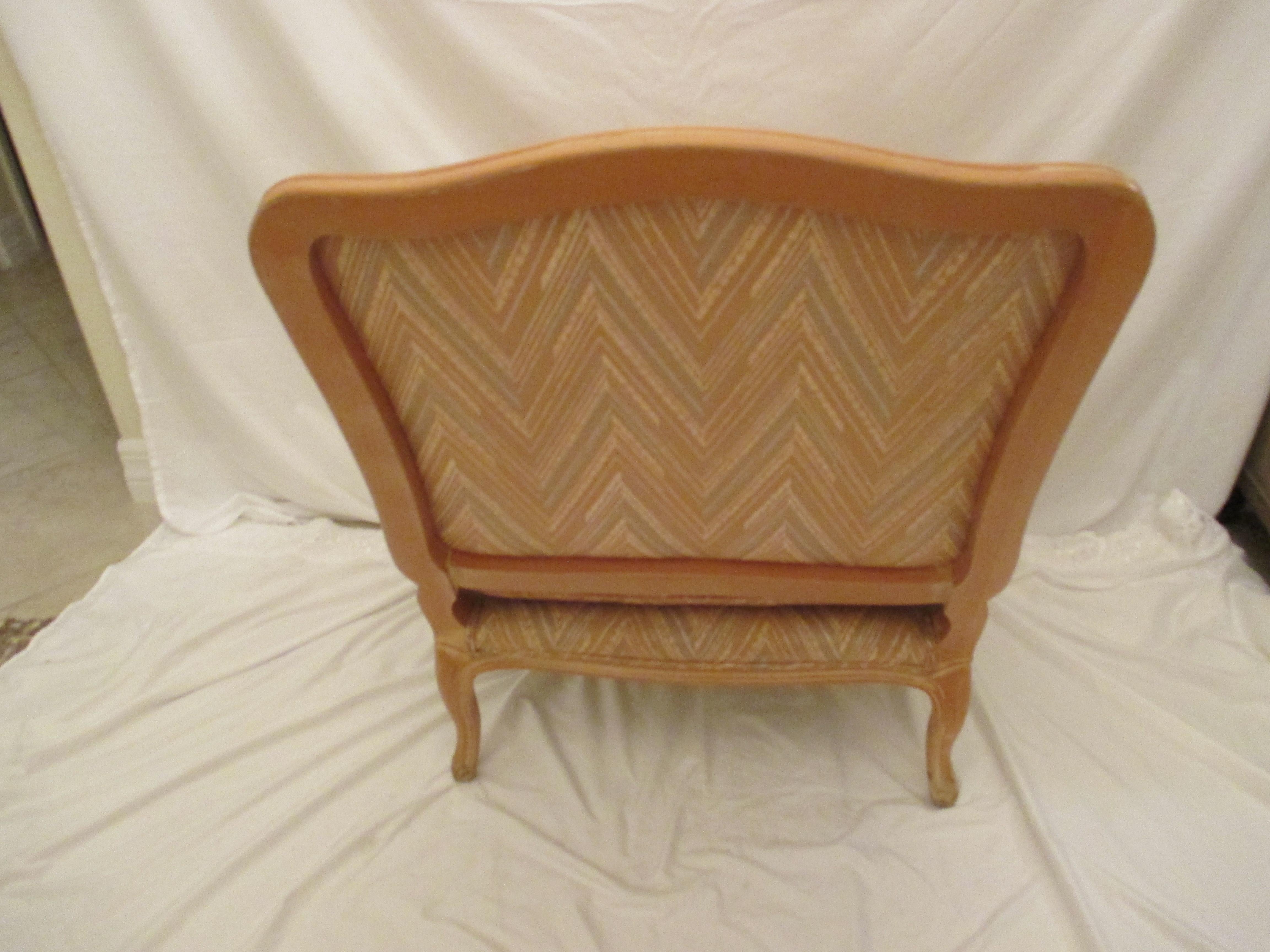Bergere chair with original chevron chintz upholstery in good condition. Chair has lumbar pillow that is included.