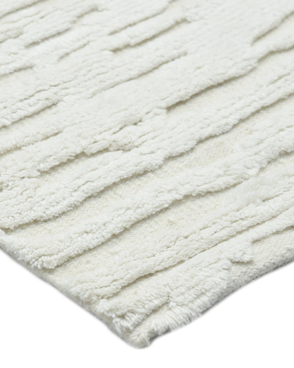 Color: Ivory. Made in: India. 80% wool, 20% cotton. Fresh, spirited, and above all, luxurious, the rugs of the Modern collection can invigorate a traditional room as gracefully as they can ground a more contemporary space. Regardless of their color