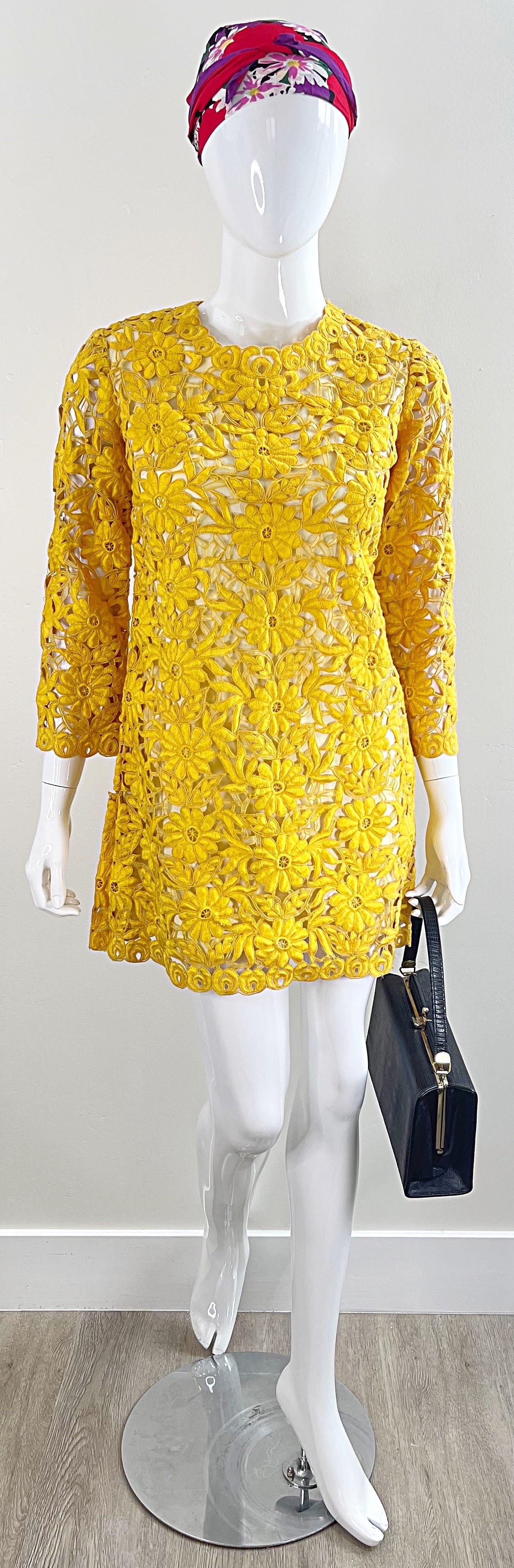 Chic 1960s mustard yellow crochet mod mini dress, or tunic top ! The body is fully lined in white cotton, while the crochet on the sleeves reveals skin. Tailored sleek fit. Full metal zipper up the back with hook-and-eye closure. Very well made,
