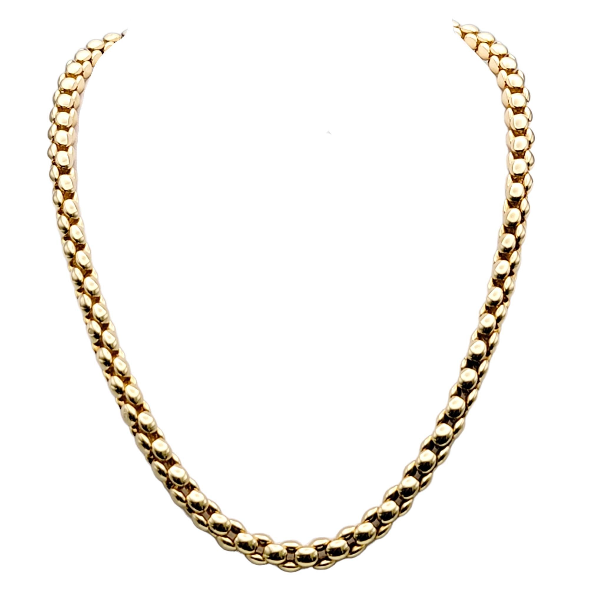 Simple yet elegant 18 karat yellow gold chain necklace by Chiampsean. This versatile piece can be dressed up or down and worn with just about everything. The timeless design gently hugs the neck, offering effortless style and sophistication. Worn