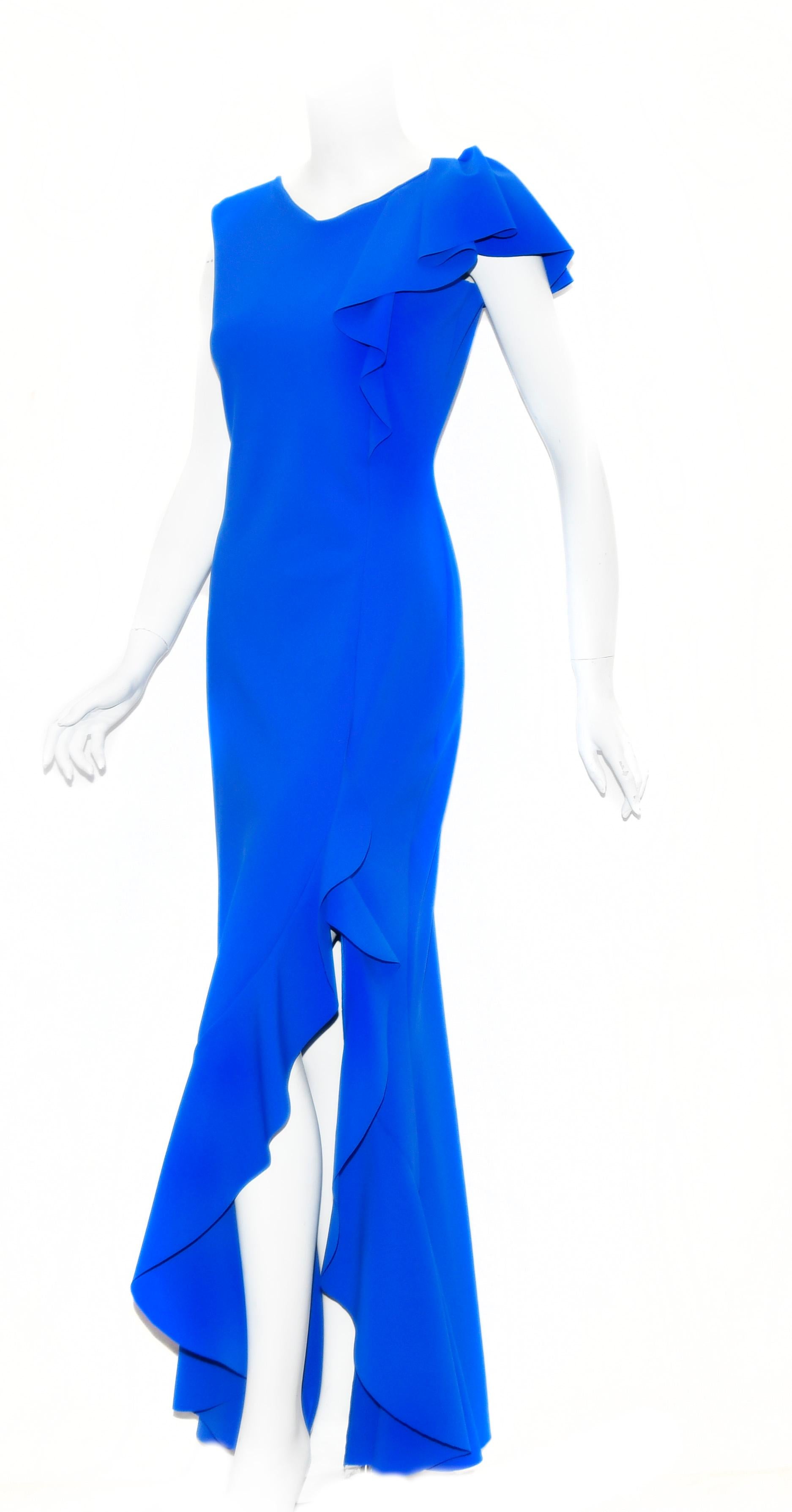 Chiara Boni royal blue Chitra asymmetric ruffle evening sheath gown has ruffles on one side of shoulder descending to the waist.  This dress incorporates a high slit at front with ruffles increasing in size down to the hem.  This suggestive dress is