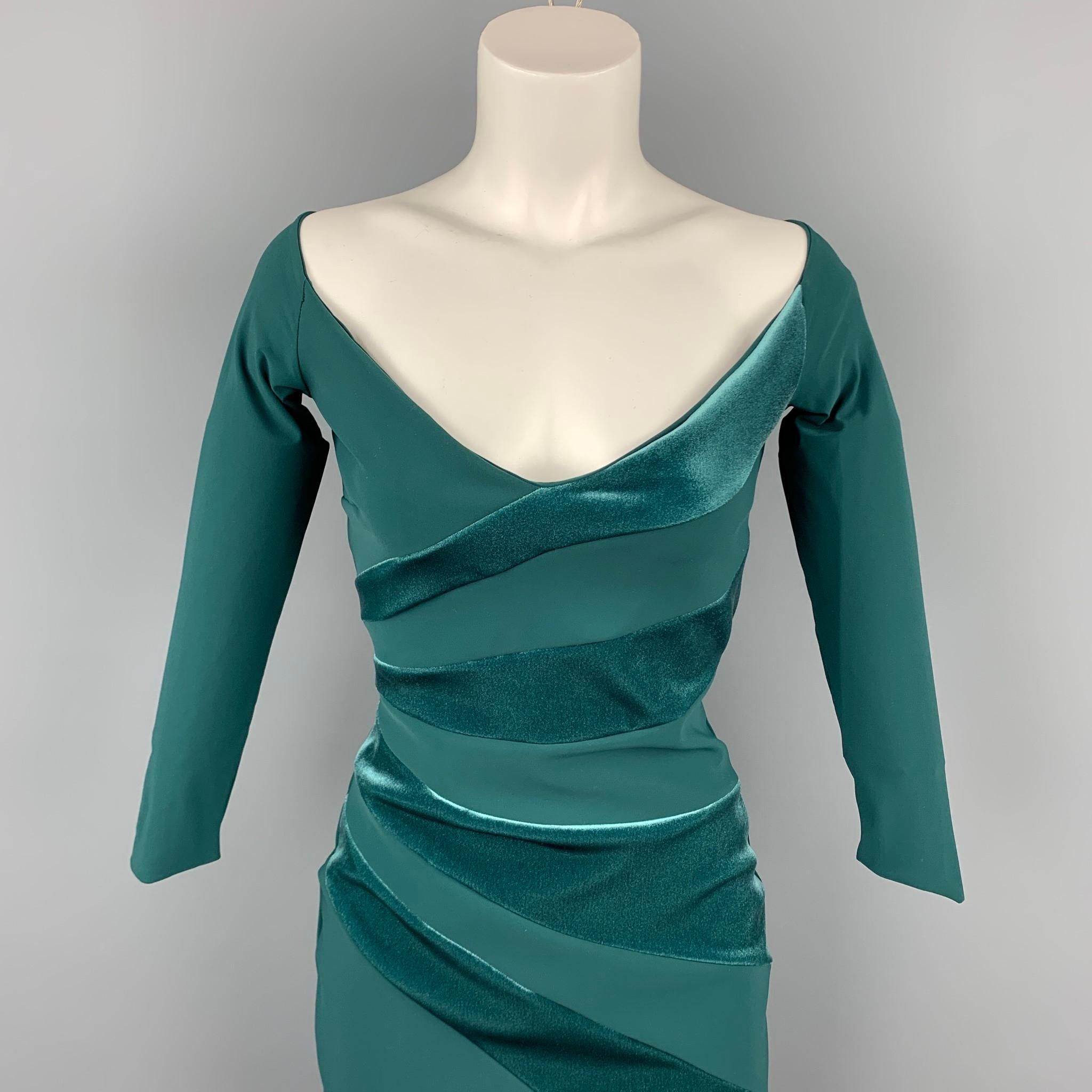 CHIARA BOIN dress comes in a green polyamide with velvet panels featuring 3/4 sleeves and a deep v-neck. Made in Italy.

Very Good Pre-Owned Condition.
Marked: IT 40
Original Retail Price: $269.00

Measurements:

Shoulder: 16.5 in.
Bust: 30