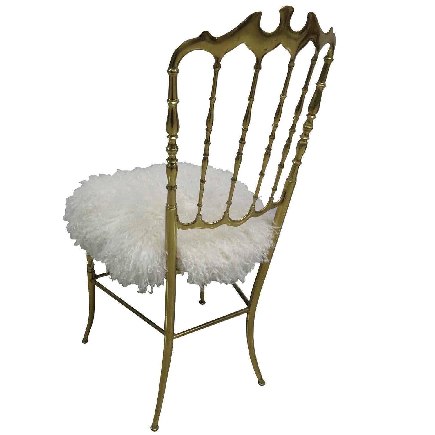 This beautiful polished brass chair was created by Chiavari of Italy in the 1970s. We have covered the seat in a super soft luxurious long haired sheeps wool, and it looks fantastic! Perfect for a bedroom, dressing room, or anyplace an interesting