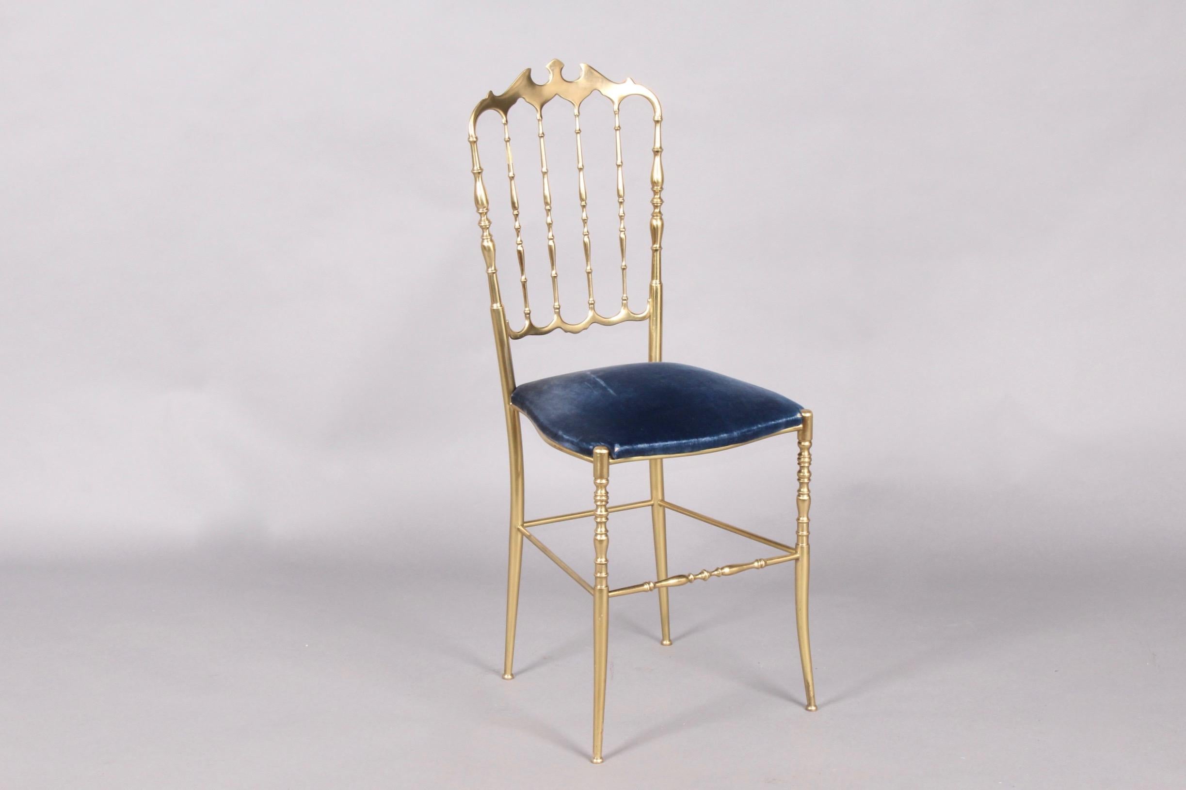 Chiavari brass and blue fabric chair.