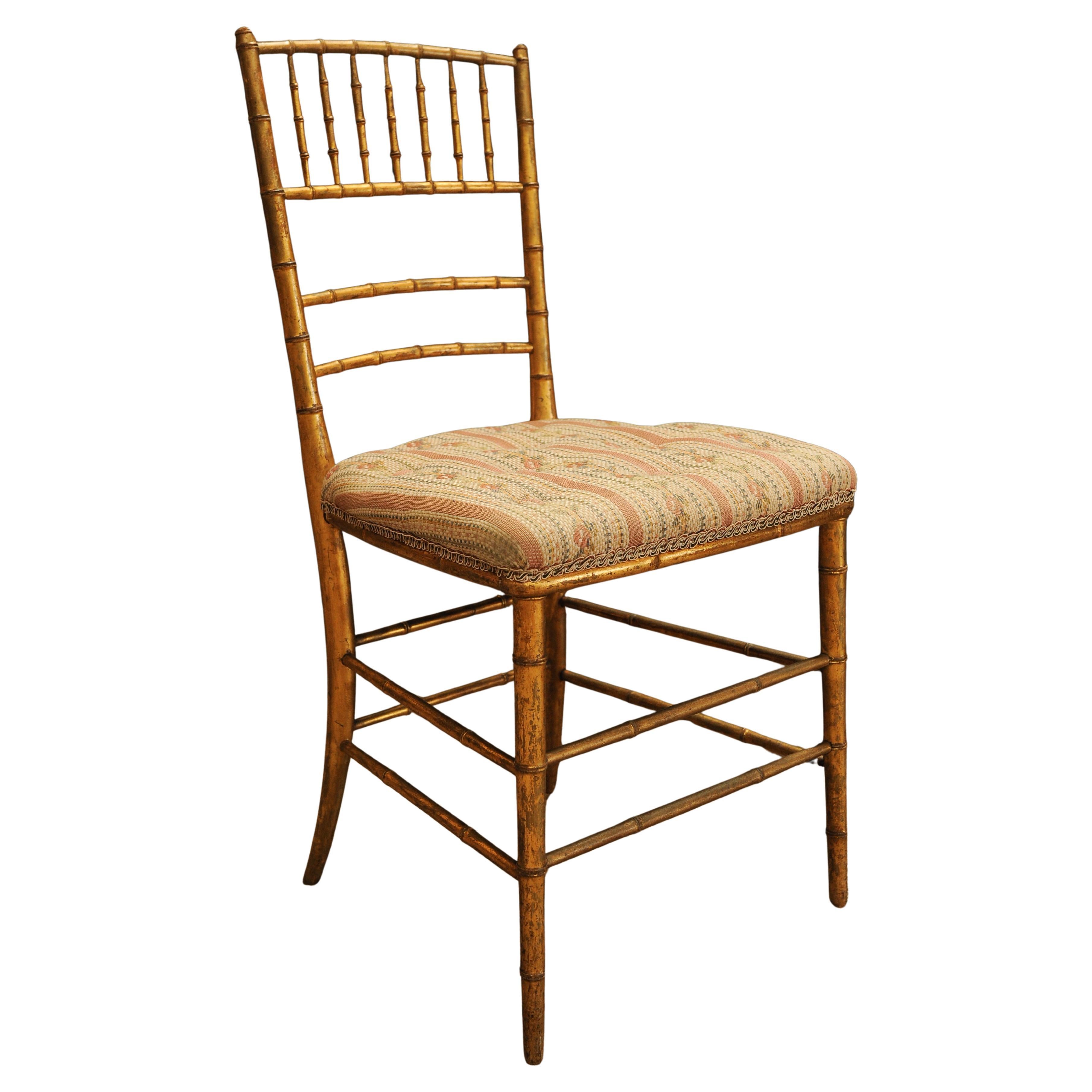 Chiavari Chair of Giltwood In A Faux Bamboo Style Striped Upholstered Seat For Sale