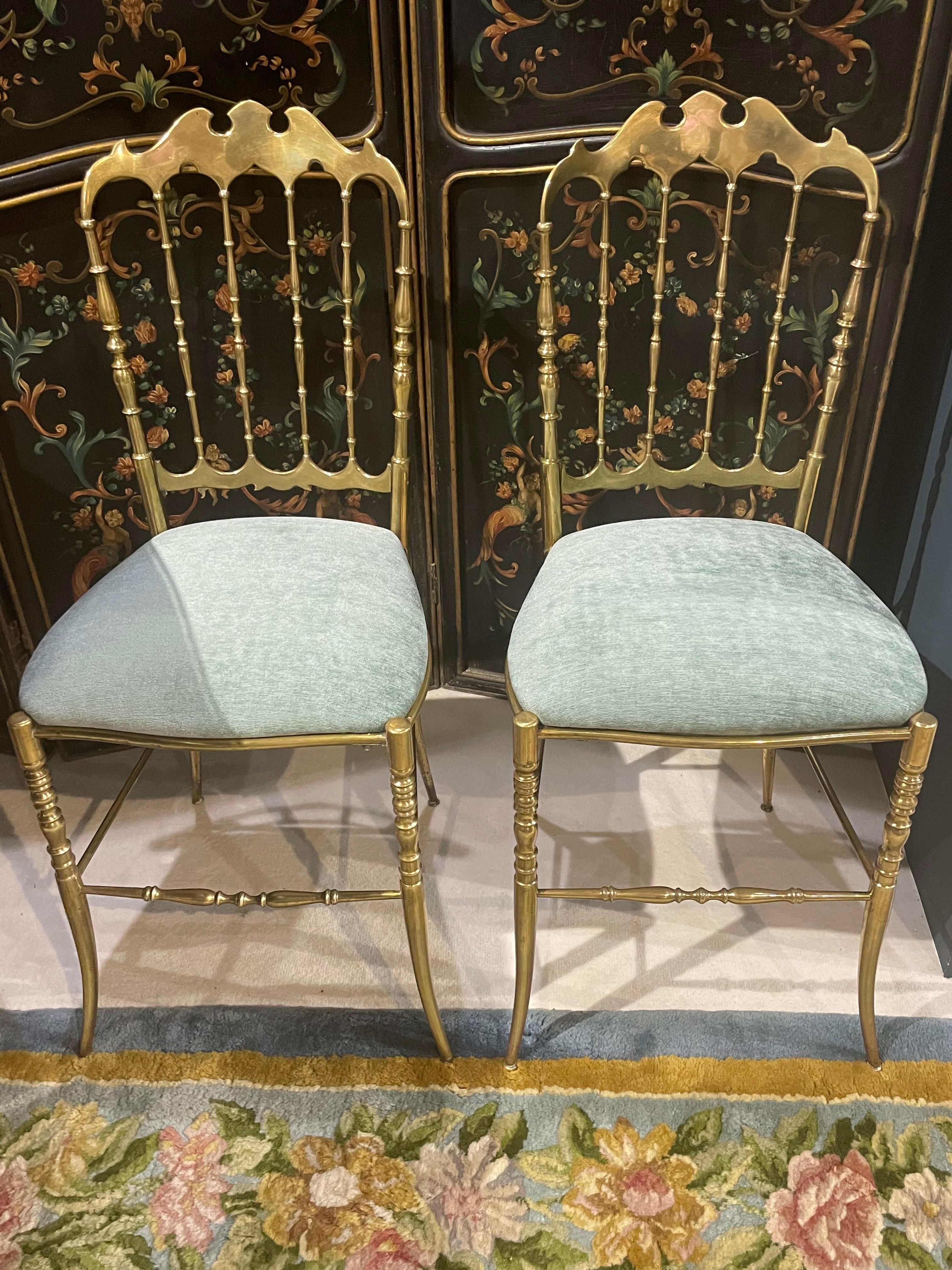 Pair of Chiavari chairs, made of solid gilded brass with newly upholstered seats in green water velvet. Made in Liguria in Italy.