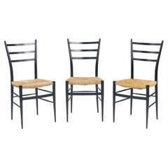 Chiavari Spinetto dining chairs with ebonized birch and straw, Italy, 1960s