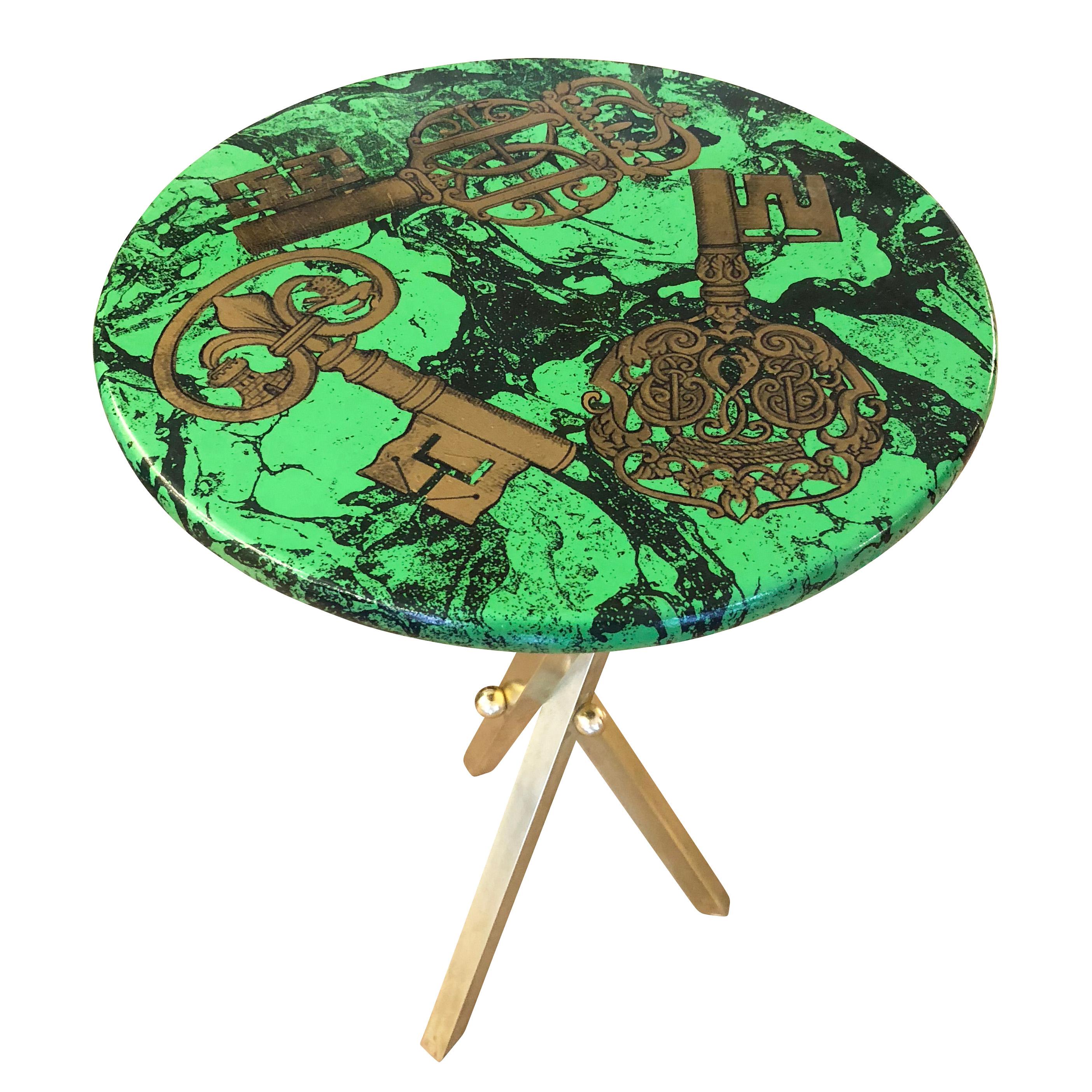 “Chiavi” side table by Piero Fornasetti depicting ancient keys on a green marble background. Brass tripod base. Original label below top.

Condition: Excellent vintage condition, minor wear consistent with age and use

Measures: Diameter