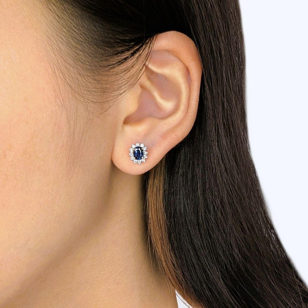 Imagine a captivating burst of deep blue and brilliant sparkle, expertly crafted in a stylish two-toned gold design. These stunning 18K two-toned gold cluster stud earrings feature two mesmerizing oval sapphires, totaling 0.36ct, their rich, dark