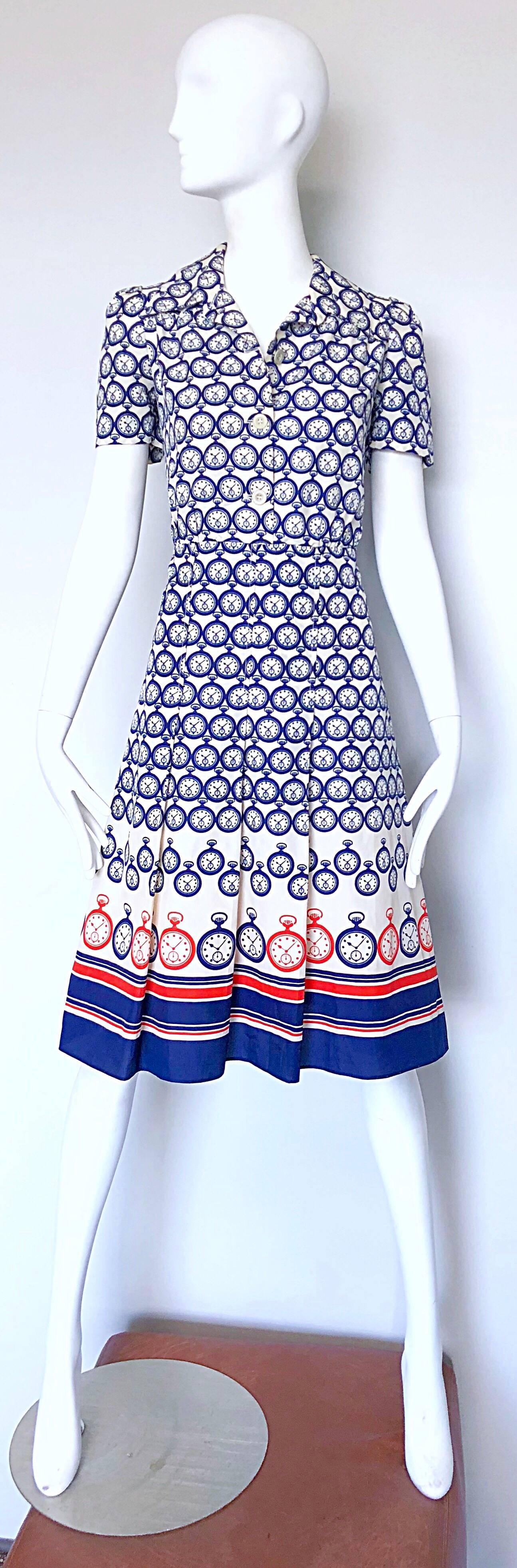 Chic vintage 1950s silk novelty pocket watch print silk fit n' flare nautical shirt dress! Features pocket watches printed throughout in red, white and navy blue. Buttons up the front with hidden zipper up the side. The possibilities are endless