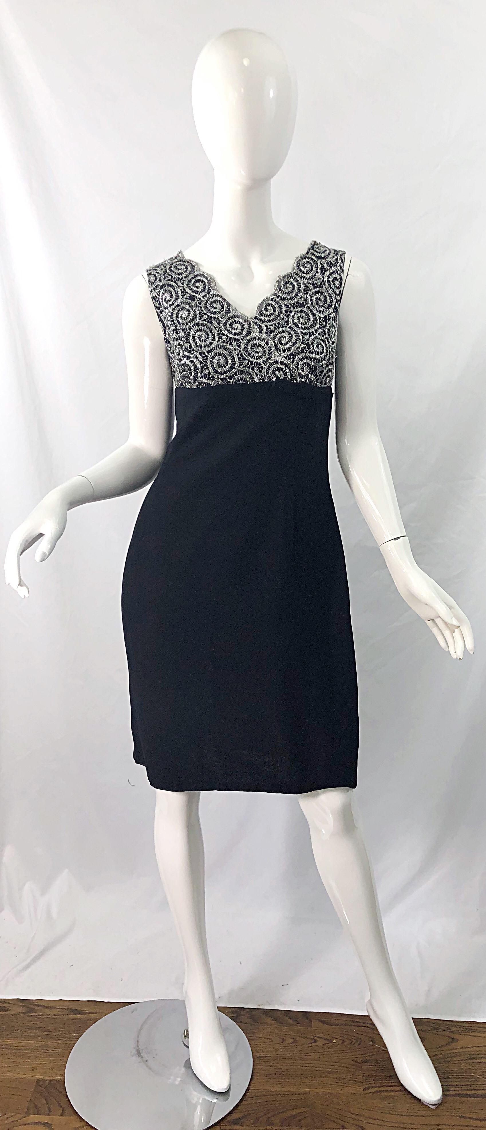 Chic 1960s black rayon crepe and silver metallic lace vintage sheath dress ! Features an empire style waist with bow at side left waist. Swag detail at center back. Full metal zipper up the back with hook-and-eye closure. The perfect little black