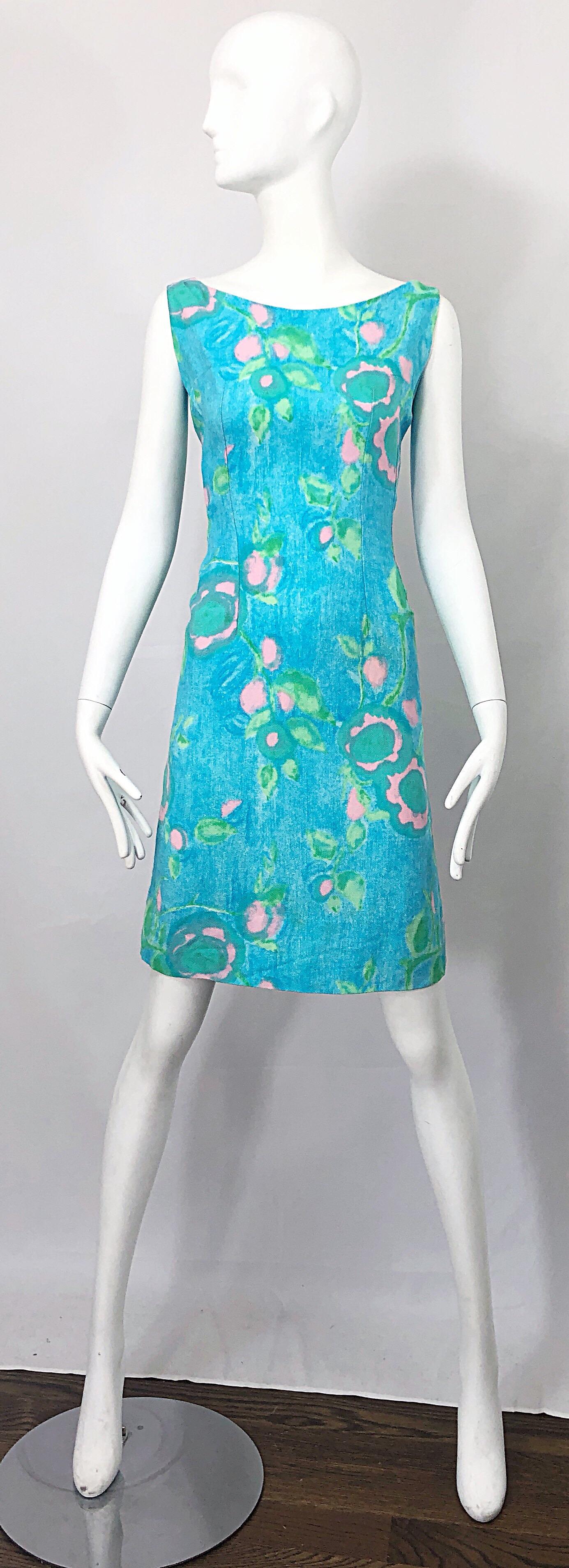 Chic early 60s blue, green and pink pastel sleeveless shift dress! Features a soft linen / cotton blend, and is fully lined. Full metal zipper up the back with hook-and-eye closure. Great belted or alone, day or evening. Perfect with flats, sandals