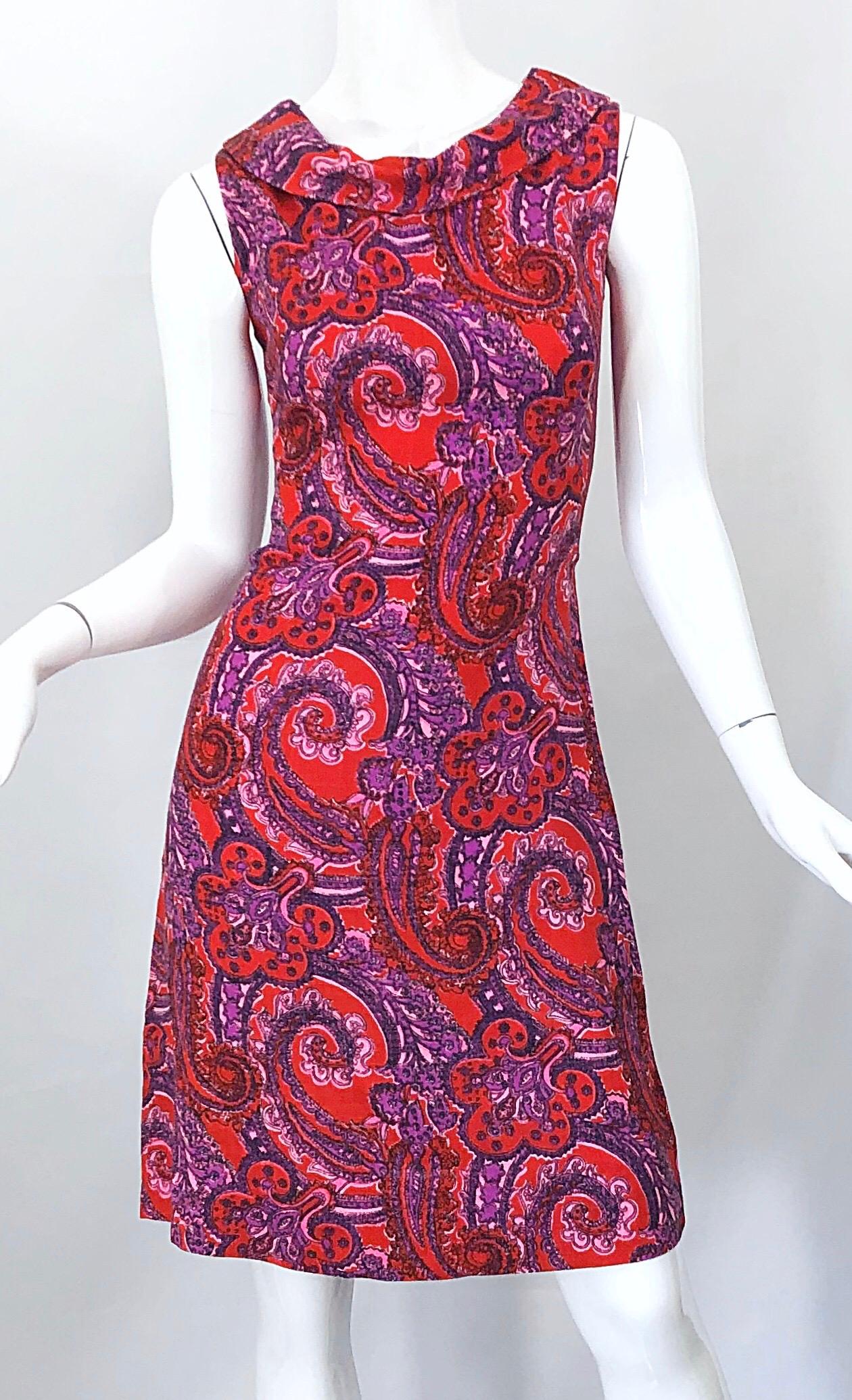 Chic mid 60s pink, red, purple and white paisley Irish Linen shift dress! Features a slight cowl neck with fitted bodice and a forgiving skirt. Full metal zipper up the back with hook-and-eye closure. Great for day or evening. Perfect with flats,