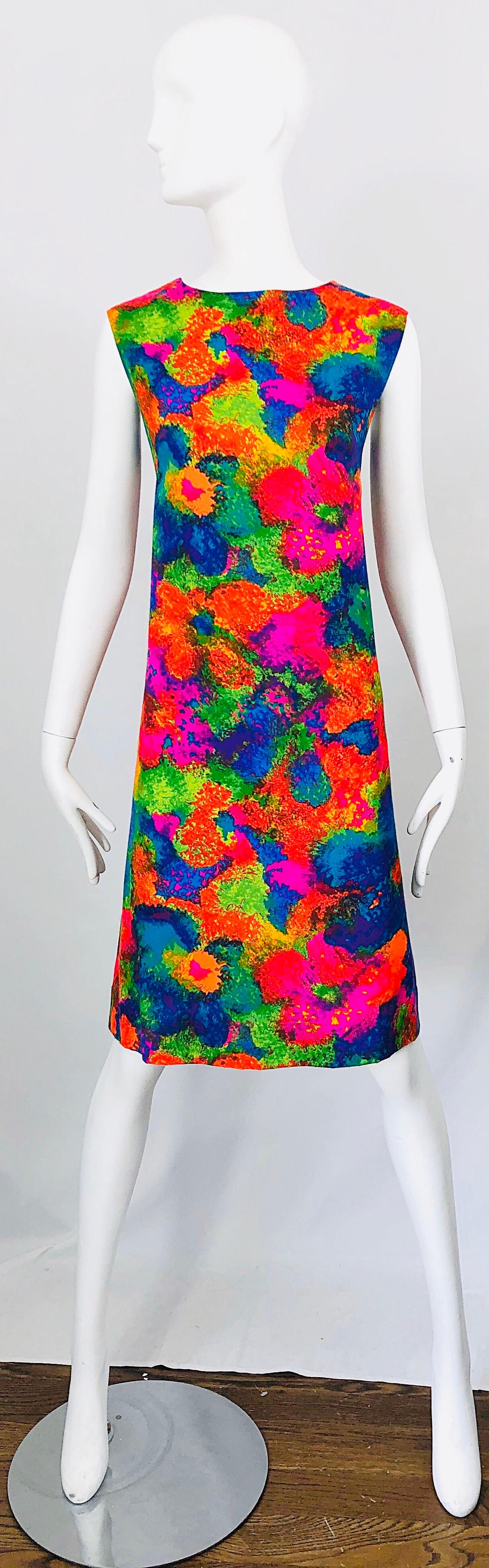 Chic 60s larger size neon abstract flower print cotton shift dress! Features vibrant colors of hot pink, neon orange, neon lime green, and bright blue throughout. hidden metal zipper up the back with hook-and-eye closure Can easily be dressed up or
