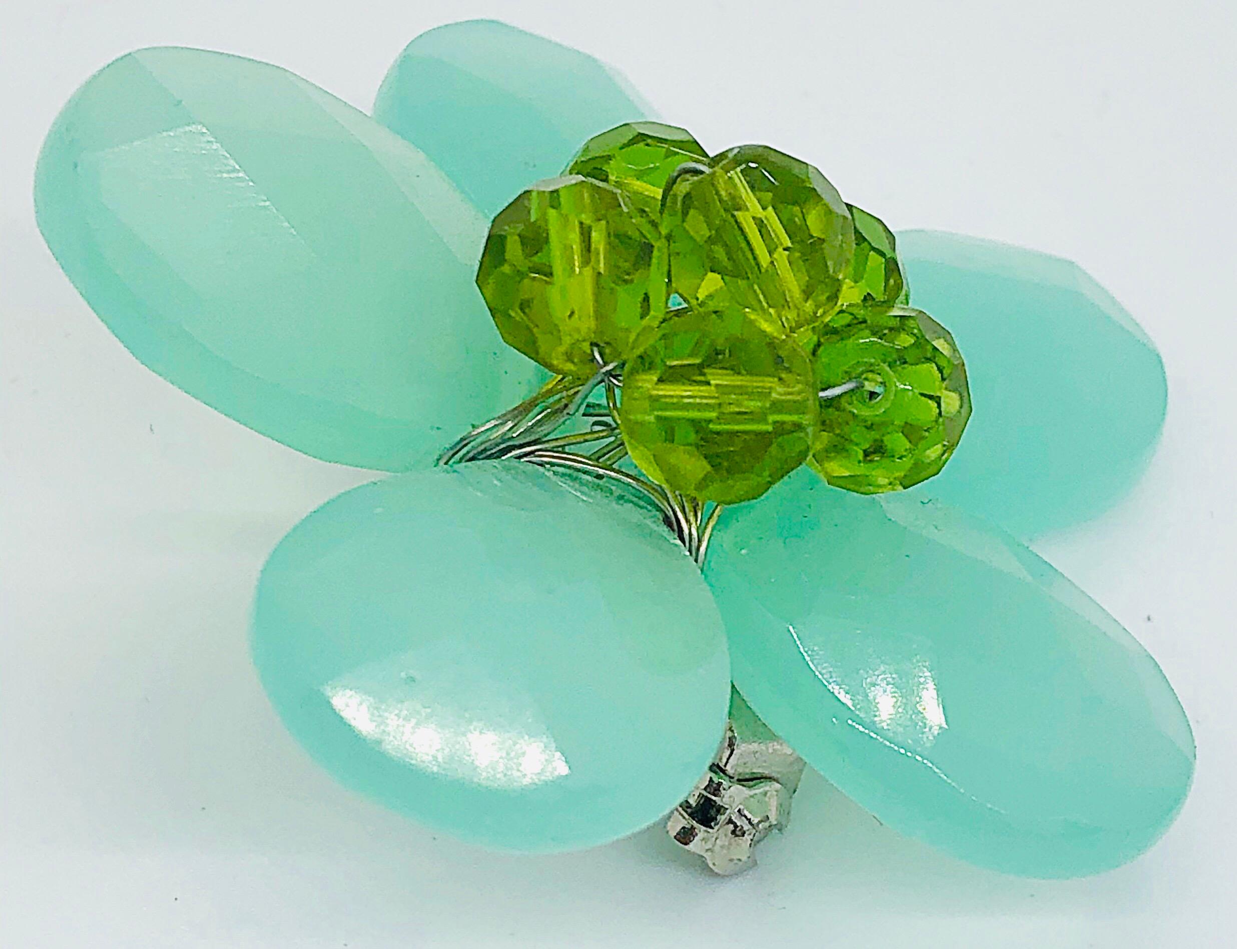 Chic 1960s mint and lime beaded lucite flower brooch pin ! Features mint green petals with lime green beads in the center. Can really make an outfit. Perfect on a denim jean jacket, blazer, cardigan, or dress. 
In great condition
Measurements:
2.25